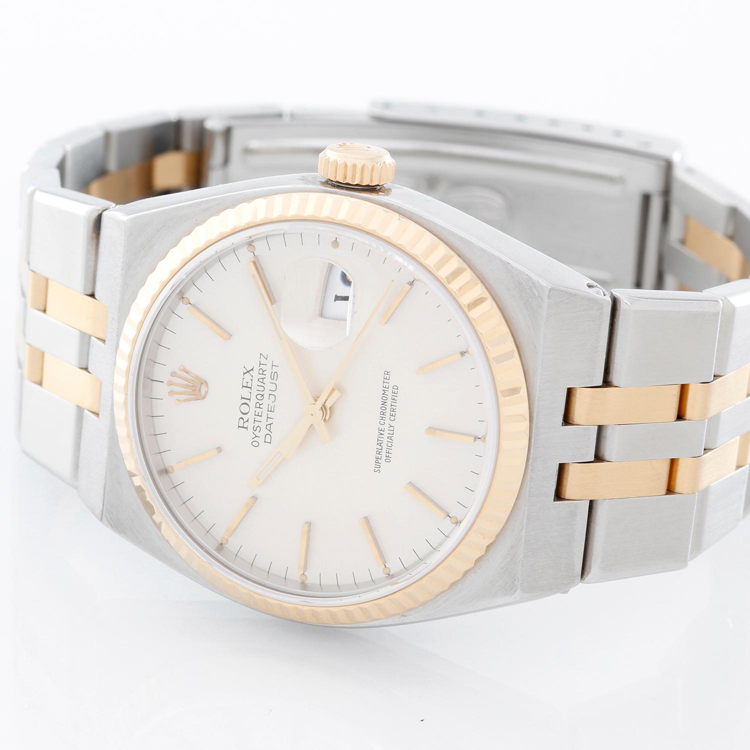 Rolex Oysterquartz Datejust 2-Tone Steel & Gold Men's Watch 17013 - Quartz, Quickset date, sapphire crystal. Stainless steel case with yellow gold fluted bezel  (35 mm diameter). Silvered dial with raised gold stick markers. Stainless steel and