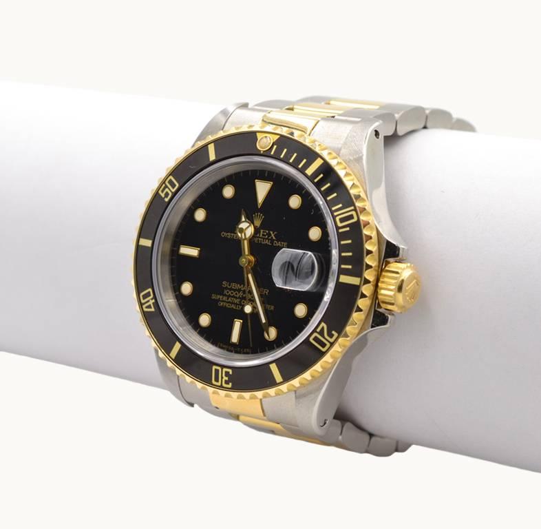 Rolex yellow gold Stainless Steel Submariner black dial Wristwatch Ref 16803 In Excellent Condition For Sale In Los Angeles, CA