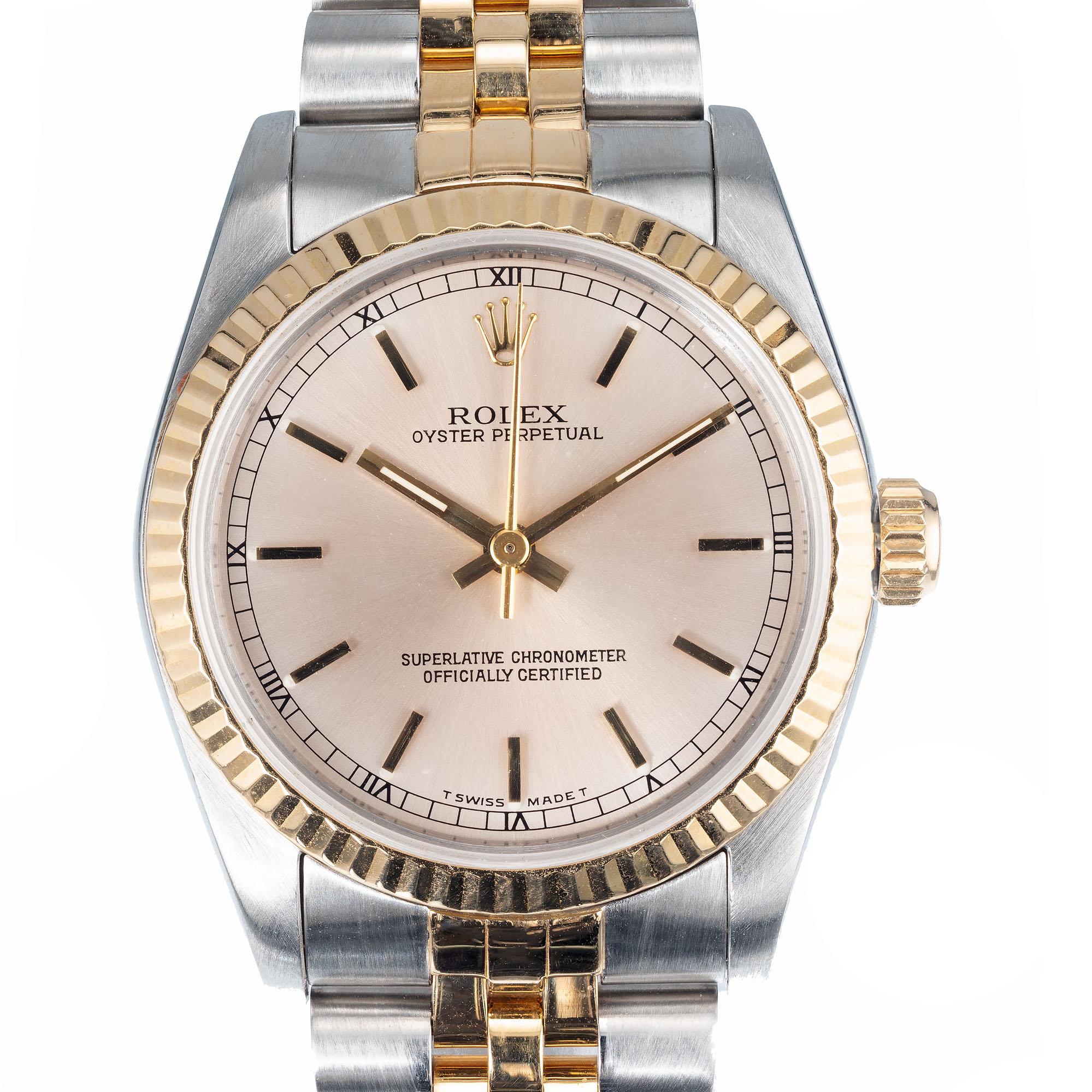 1992 Rolex midsize 67513 oyster perpetual champagne dial date in 18k yellow gold and steel. Jubilee Rolex band. All factory original  

Length: 37.11mm
Width: 30mm
Band width at case: 17mm
Case thickness: 10.37mm
Band: Two tone jubilee
Crystal: