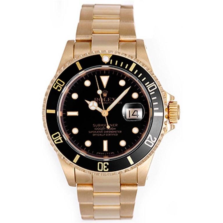 Rolex Submariner 18k Gold Men's Watch Black Dial  16618 -  Automatic winding, 31 jewels, Quickset, sapphire crystal. 18k yellow gold case with rotating bezel with black insert (40mm diameter). Black dial with luminous style markers. 18k yellow gold