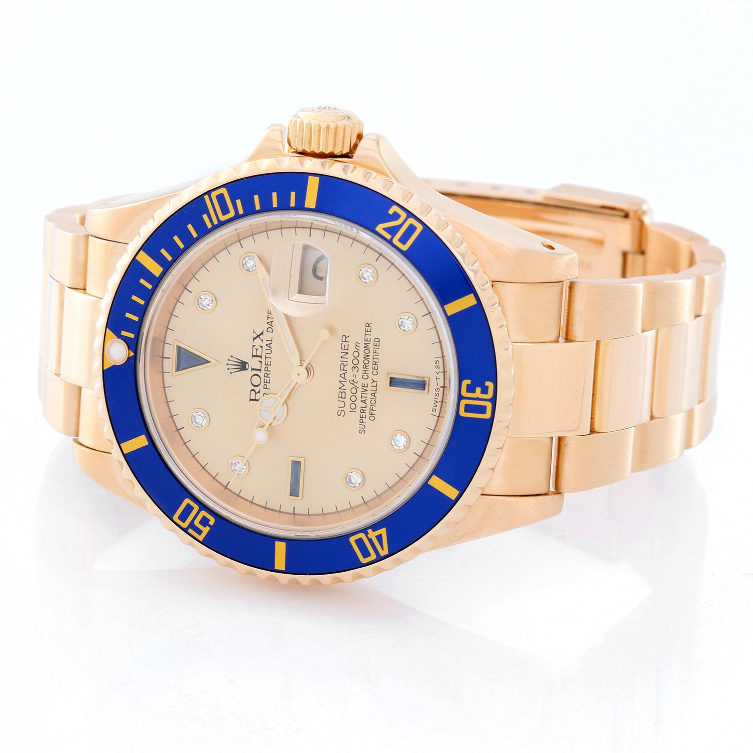 Rolex Submariner 18k Gold Men's Watch Champagne Dial  16618 - Automatic winding, 31 jewels, Quickset, sapphire crystal. 18k yellow gold case with rotating bezel with blue insert (40mm diameter). Champagne Serti dial with diamond and sapphire hour