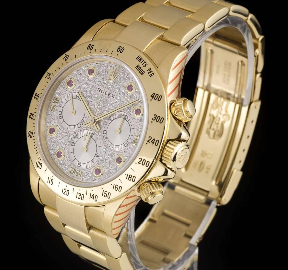 A Rare 18k Yellow Gold Oyster Perpetual Zenith Movement Cosmograph Daytona Gents Wristwatch, pave diamond dial with 8 applied ruby hour markers, 30 minute recorder at 3 0'clock, 12 hour recorder at 6 0'clock, small seconds at 9 0'clock, a fixed 18k