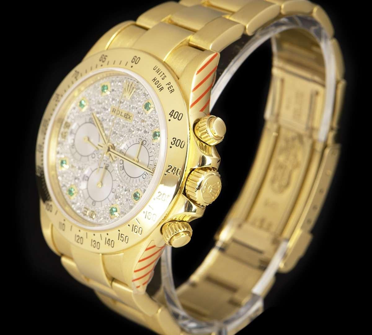 An 18k Yellow Gold Oyster Perpetual Zenith Movement Cosmograph Daytona Gents Wristwatch, pave diamond dial with 8 applied round brilliant cut emerald hour markers and white gold sub-dials, 30 minute recorder at 3 0'clock, 12 hour recorder with at 6