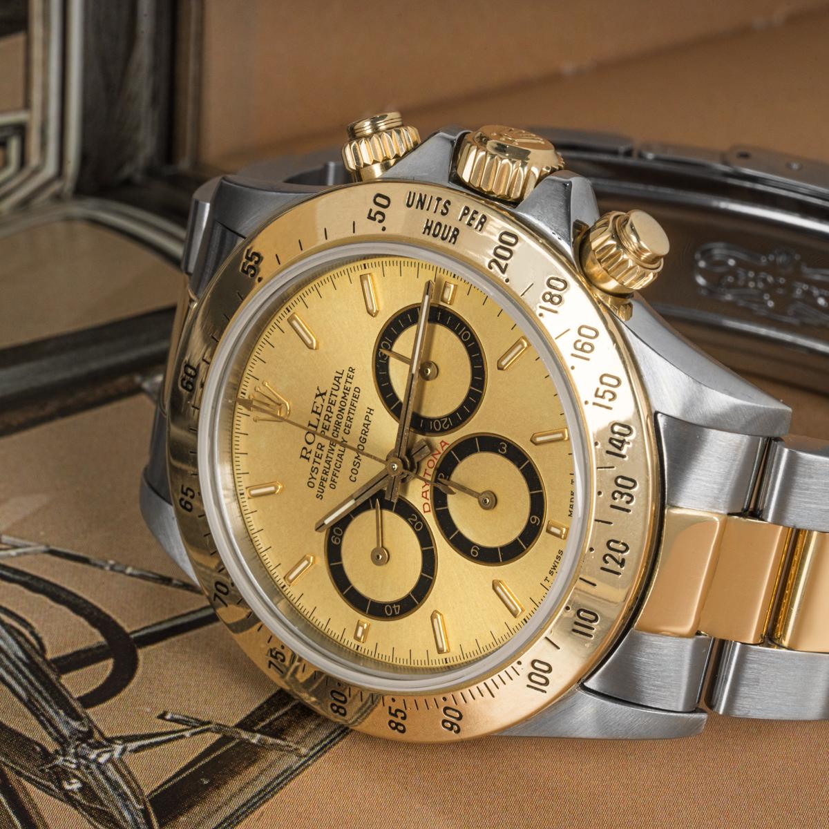 A Rare Stainless Steel and 18k Yellow Gold Oyster Perpetual Zenith Movement Cosmograph Daytona Men's Wristwatch, rare Mark I floating champagne dial with applied hour markers, 30 minute recorder at 3 0'clock, 12 hour recorder with inverted 6 at 6