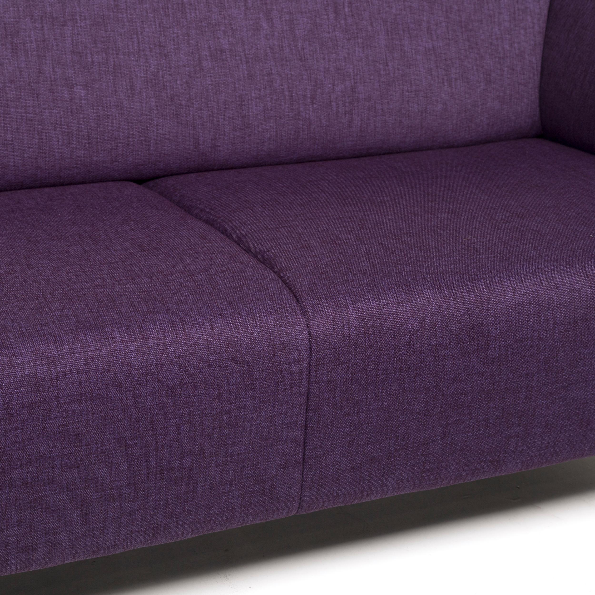 We bring to you a Rolf Benz fabric sofa purple three-seat couch.
 
 

 Product measurements in centimeters:
 

Depth 83
Width 174
Height 74
Seat-height 43
Rest-height 69
Seat-depth 55
Seat-width 124
Back-height 33.