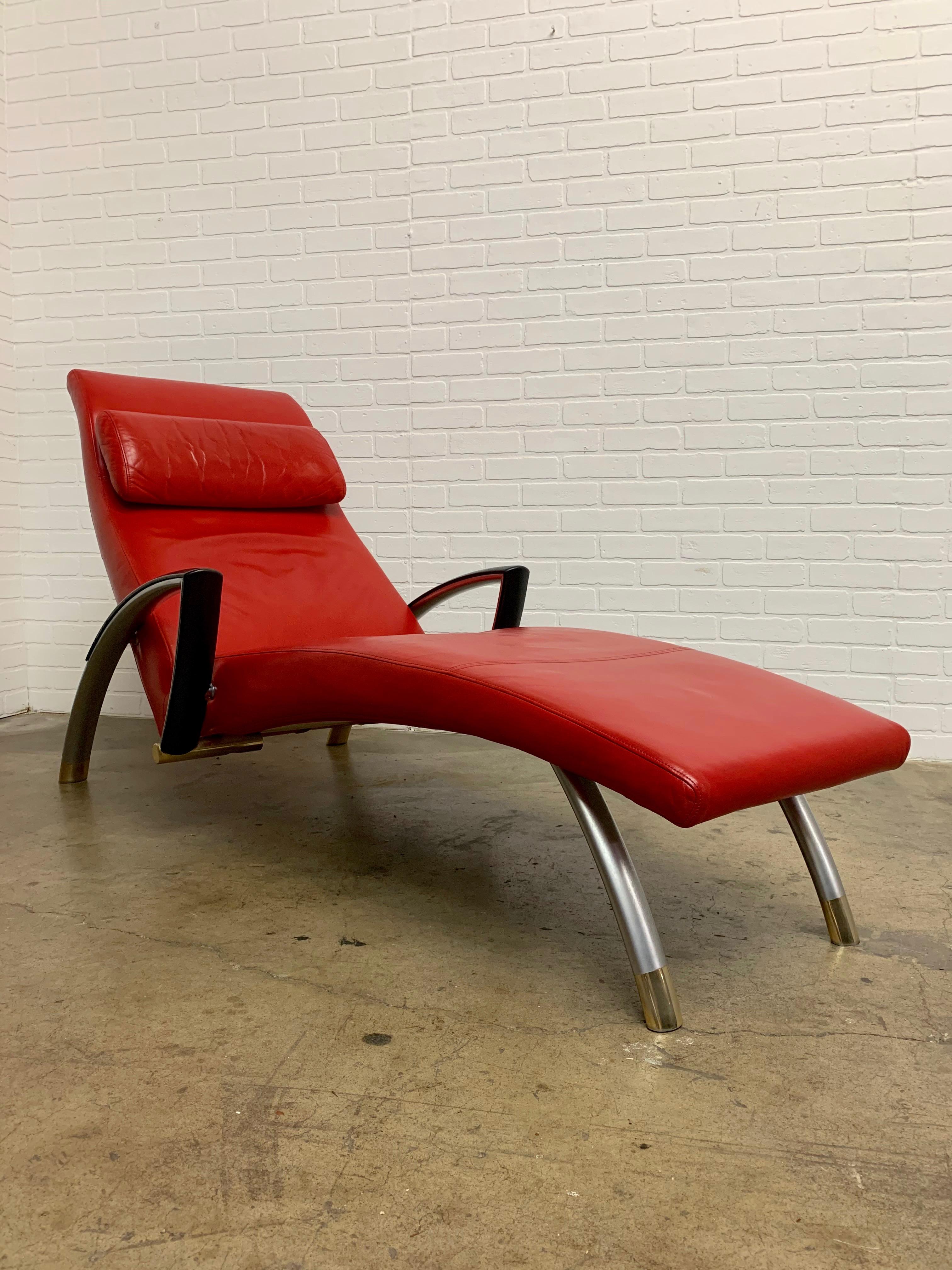 Supple lipstick red leather with brass and silver accents. The pillow is magnetized to stay in place , please see video.