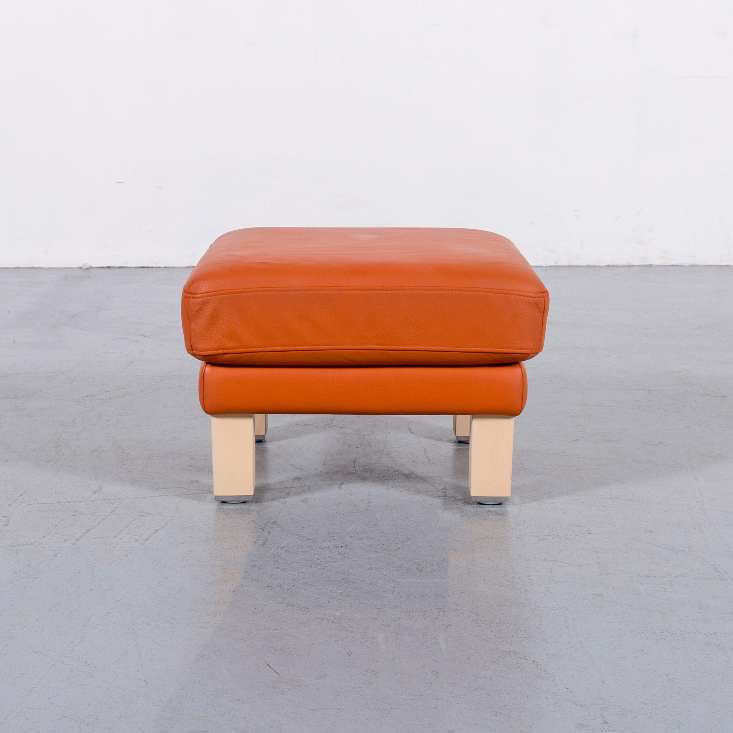 We bring to you an Rolf Benz leather foot-stool orange bench.






























   