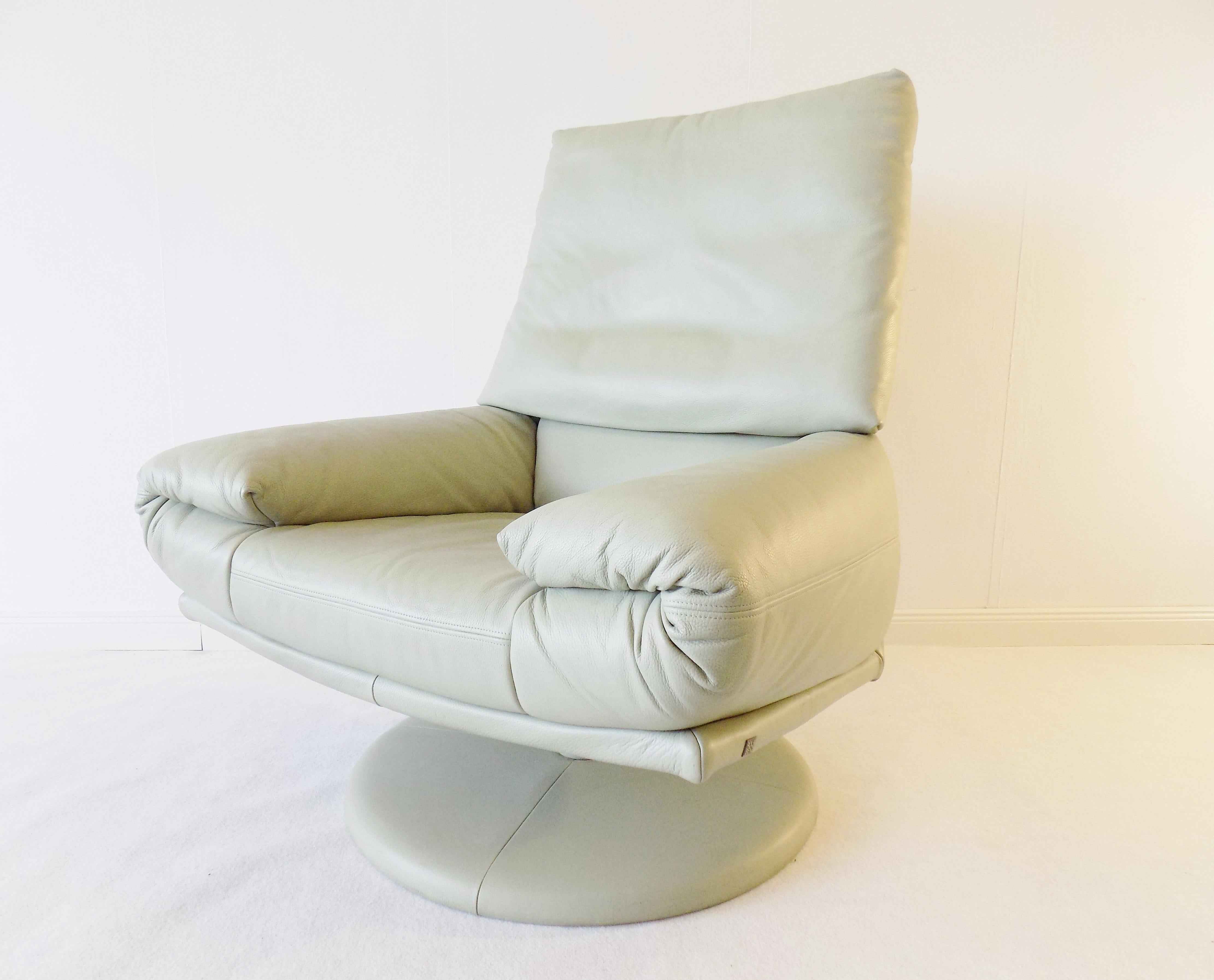 Lounge chair from Rolf Benz/bmp in a light mint colored leather. The leather in highest quality is, except from two small parts in the corners of the backrest, in an excellent condition. Also the in leather covered base is without tear and wear. The