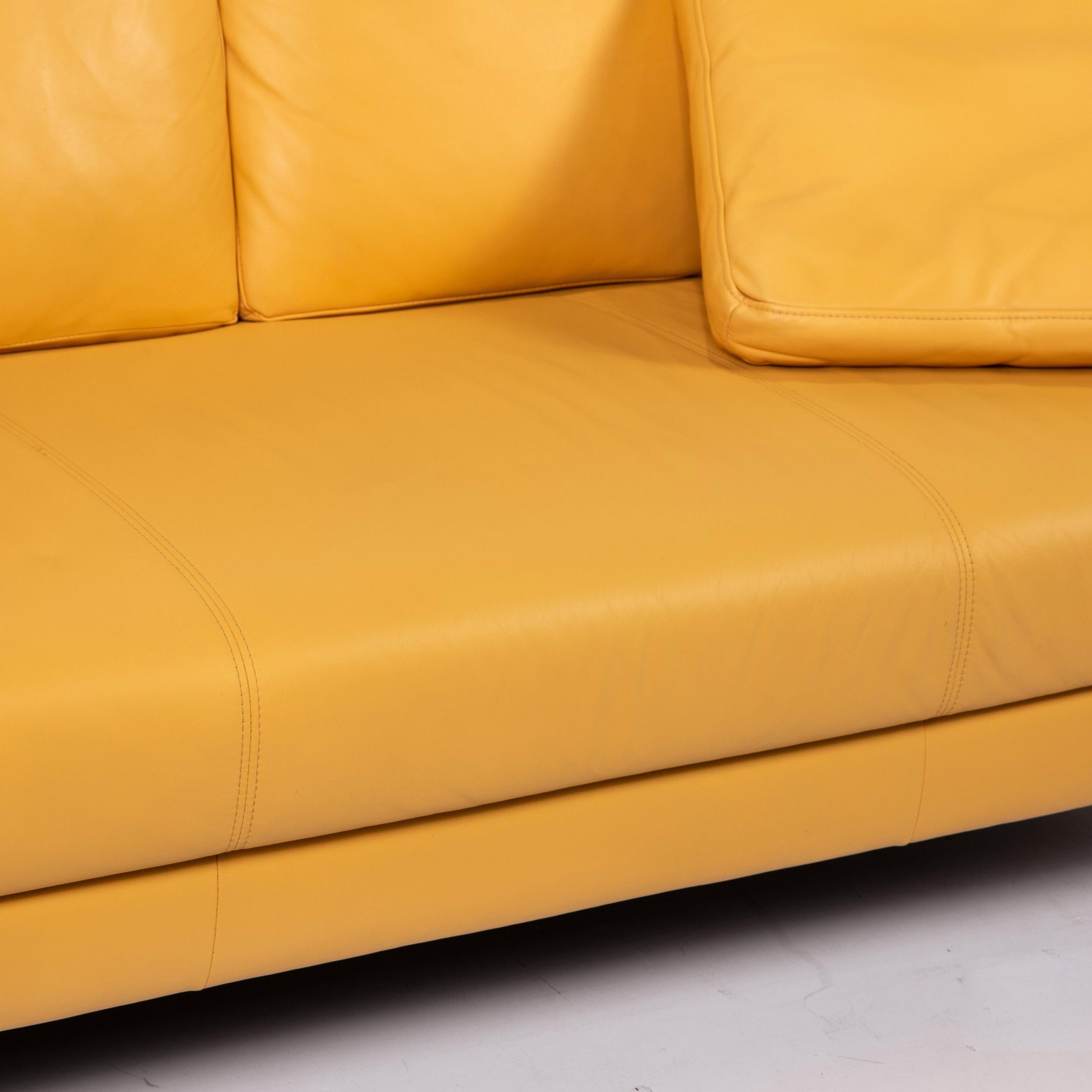 yellow two seater sofa