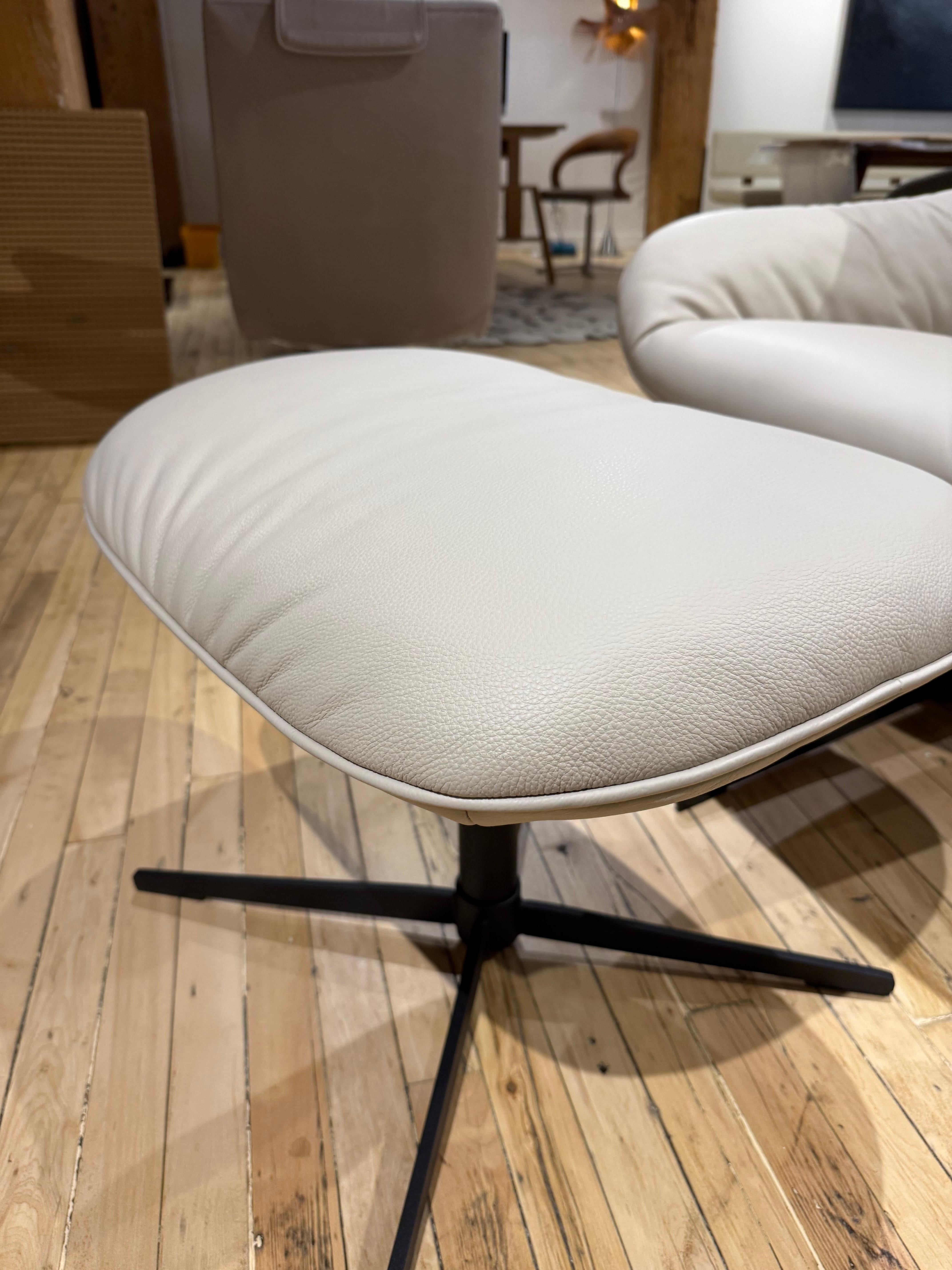 Contemporary Rolf Benz 'Meg' Swiveling Armchair with Tilt and Footstool in Off White Leather For Sale