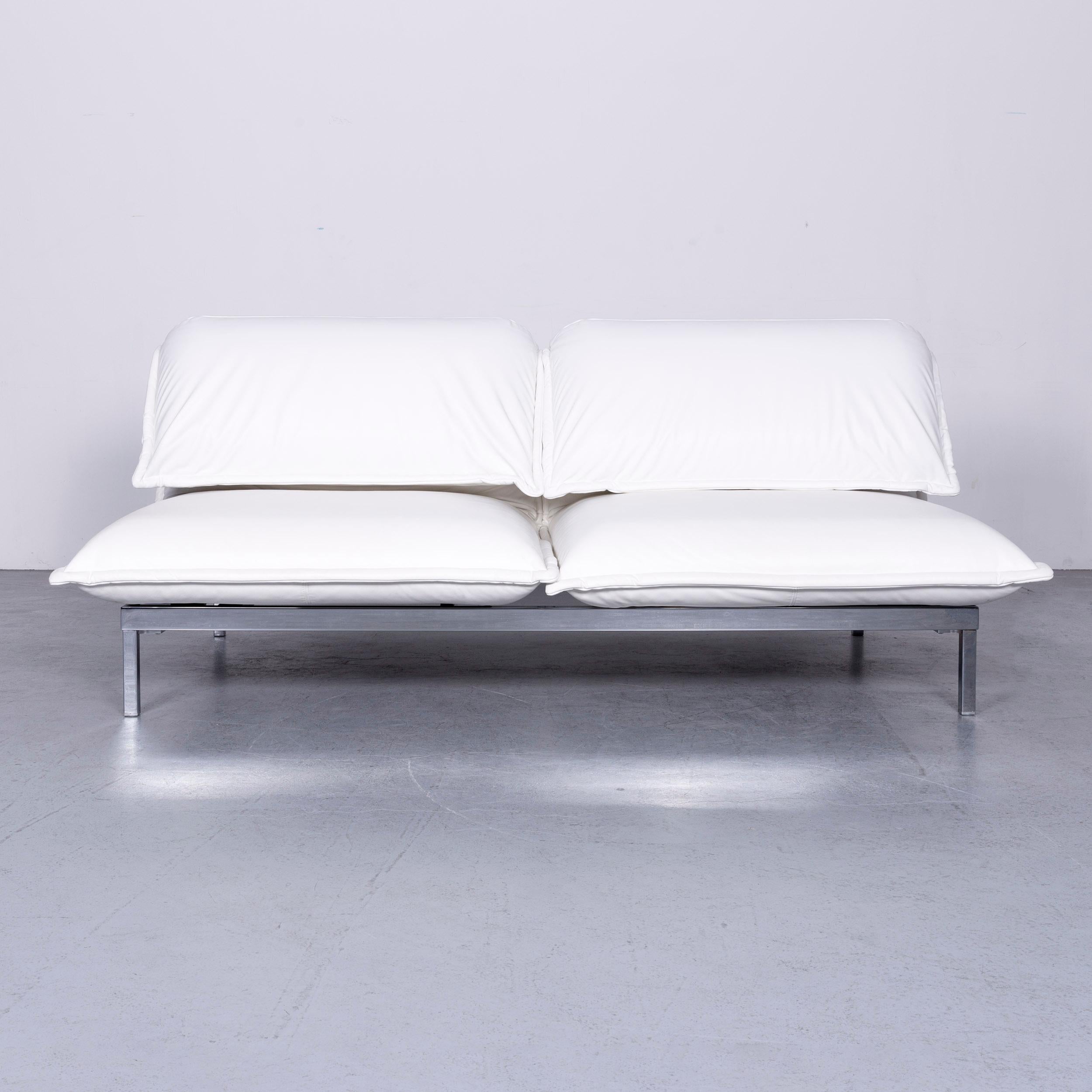 We bring to you a Rolf Benz Nova leather sofa white three-seat couch with function.