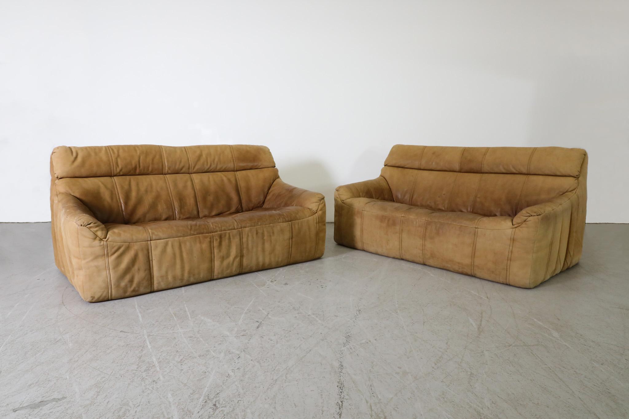 Mid-Century, nubuck leather sofas by German furniture manufacturer Rolf Benz. Designed and made in the 1970s. Handsomely designed with inviting soft form frames covered with durable, leather upholstery. Sofas have a beautiful, well-loved patina.