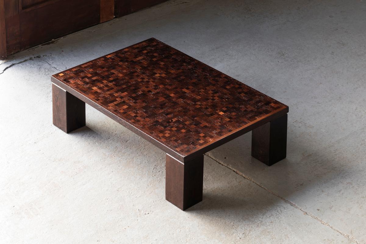 Brutalist coffee table designed by Rolf Middelboe and produced by Tranekær Furniture in Denmark in the 1970s. Made of solid wengé and wengé veneer, featuring a table top in a checkered, mosaic intarsia. The design carries some influences from the