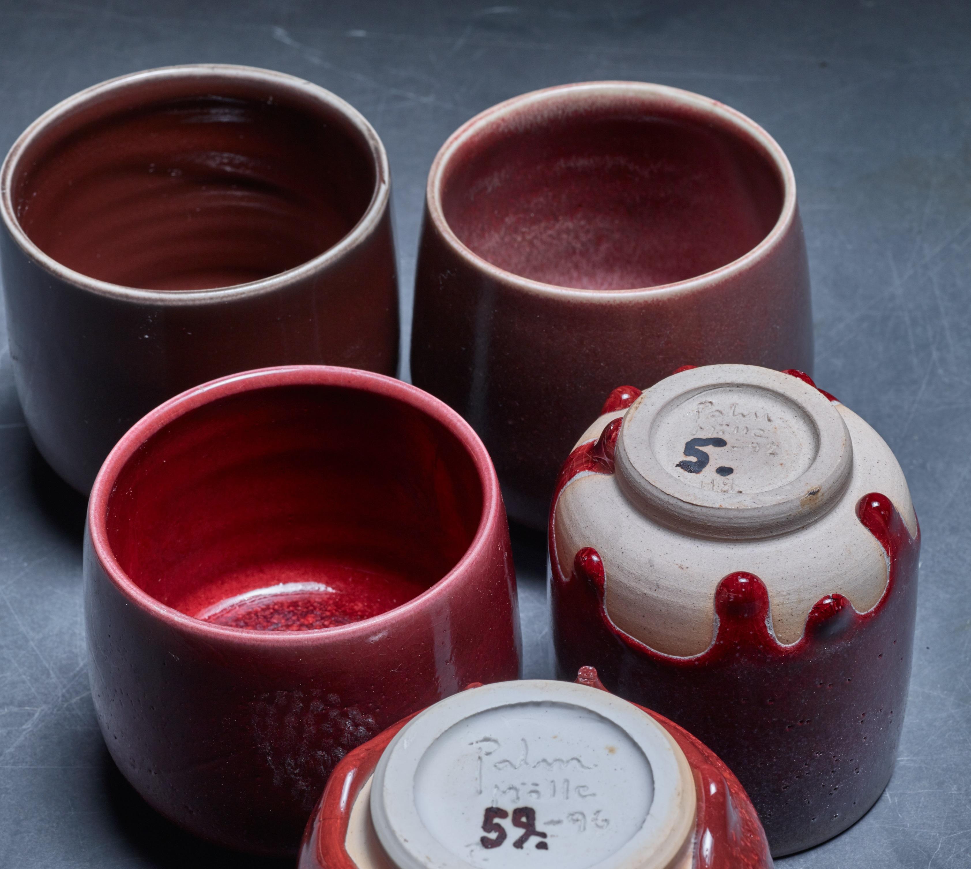 A set of five ceramic vases with a red-brown glaze finish by Rolf Palm.

The pieces are signed by Palm with the year of production (1991 and 1996). Measures: The shortest vase is 8.5 (3.3 inch) high with a 10 cm (4 inch) diameter. The tallest one is