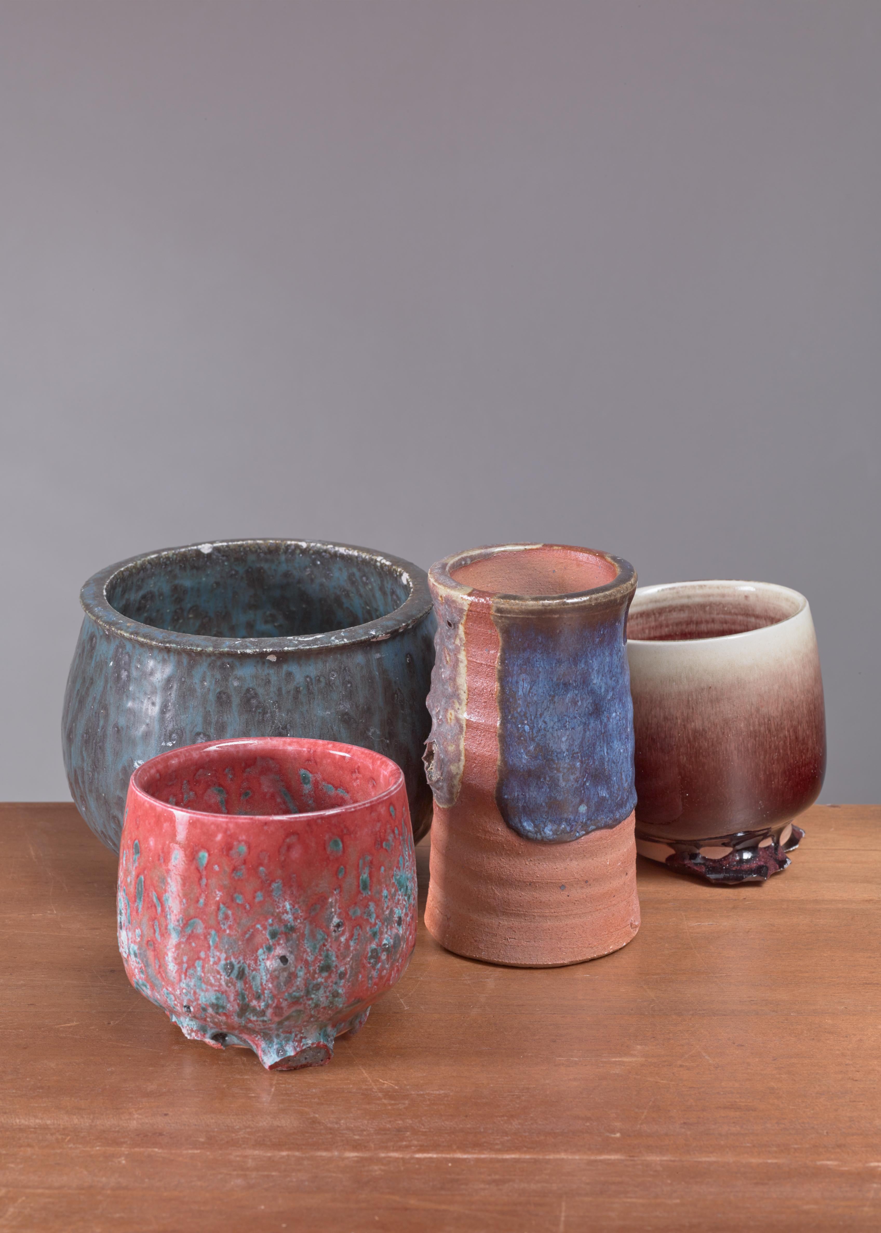 A set of four ceramic vases with a rough, multi-color glaze by Rolf Palm.
Measures: The smallest piece is 5.5 cm (2 inch) high and has a 10 cm (4 inch) diameter. The tallest piece is 11.5 cm (4.5 inch) high with a 15 cm (6 inch) diameter.

All