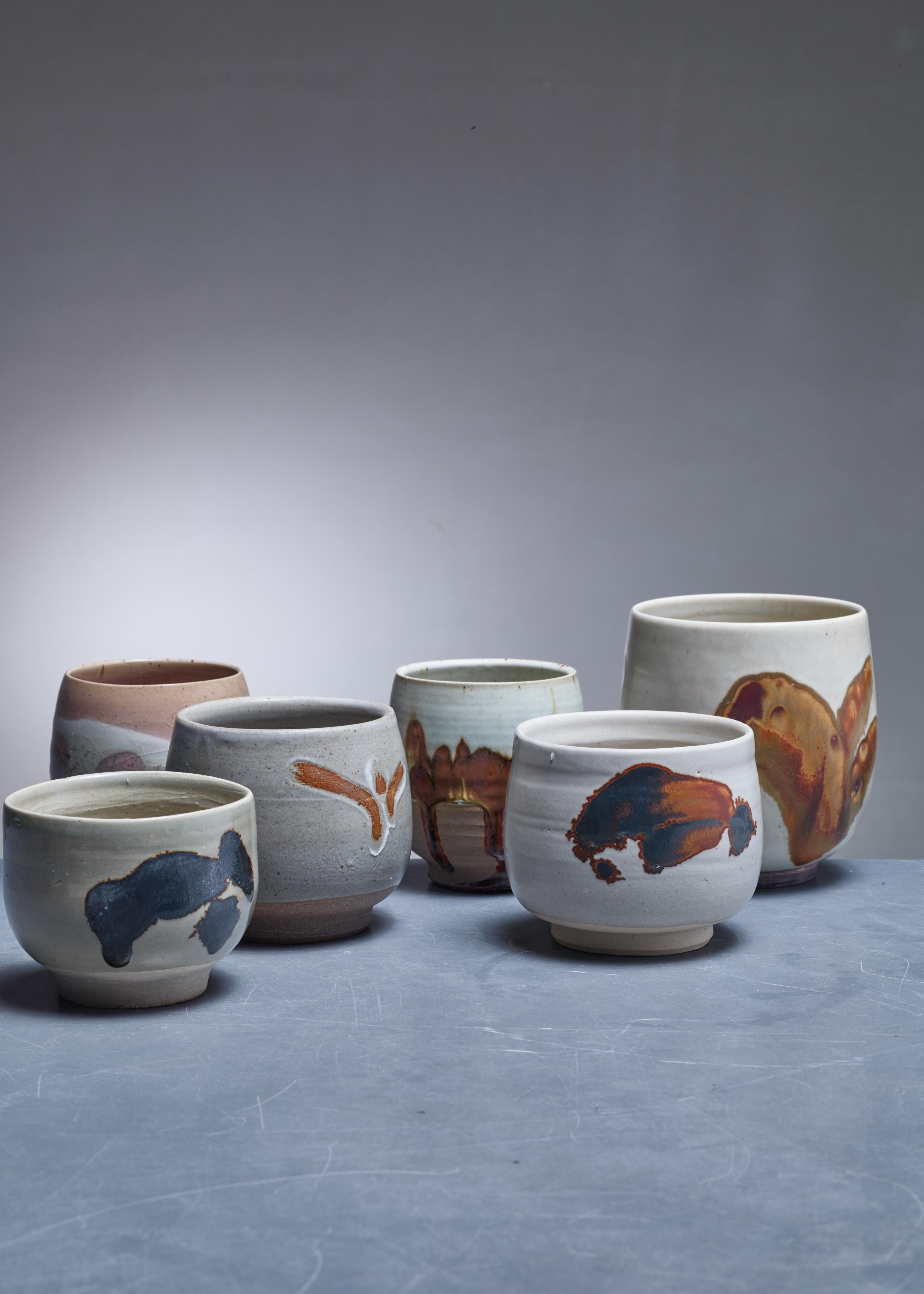 A set of six ceramic vases with an earth-tone glaze finish and abstract figures, by Rolf Palm.

The pieces are signed by Palm, some with the year of production. Measures: The shortest vase is 8.5 cm (3.3 inch) high with a 10.5 cm (4 inch)