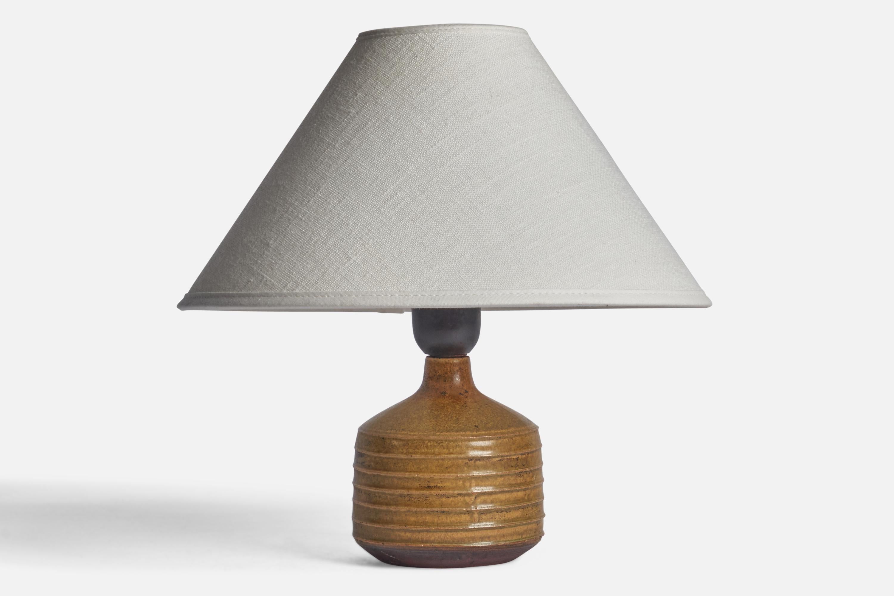 A small table lamp designed and produced by Rolf Palm, Mölle, Sweden, 1960s.

Dimensions of Lamp (inches): 7” H x 3.5” Diameter
Dimensions of Shade (inches): 2.5” Top Diameter x 10” Bottom Diameter x 5.5