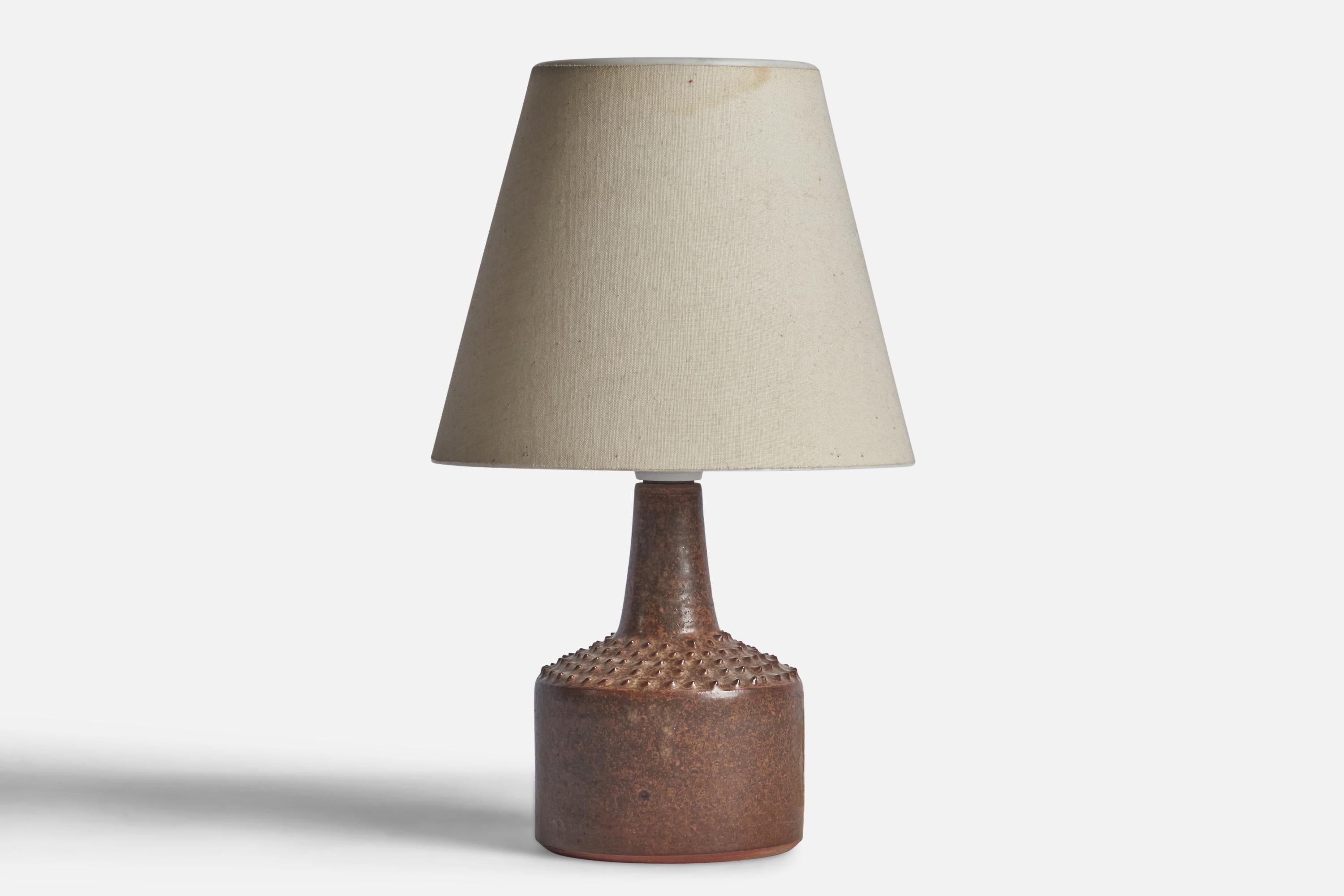 A small brown-glazed stoneware table lamp designed and produced by Rolf Palm, Mölle, Sweden, 1960s.

“Palm” stamp on bottom

Dimensions of Lamp (inches): 7.75” H x 3.5” Diameter
Dimensions of Shade (inches): 3.5” Top Diameter x 6.4” Bottom Diameter