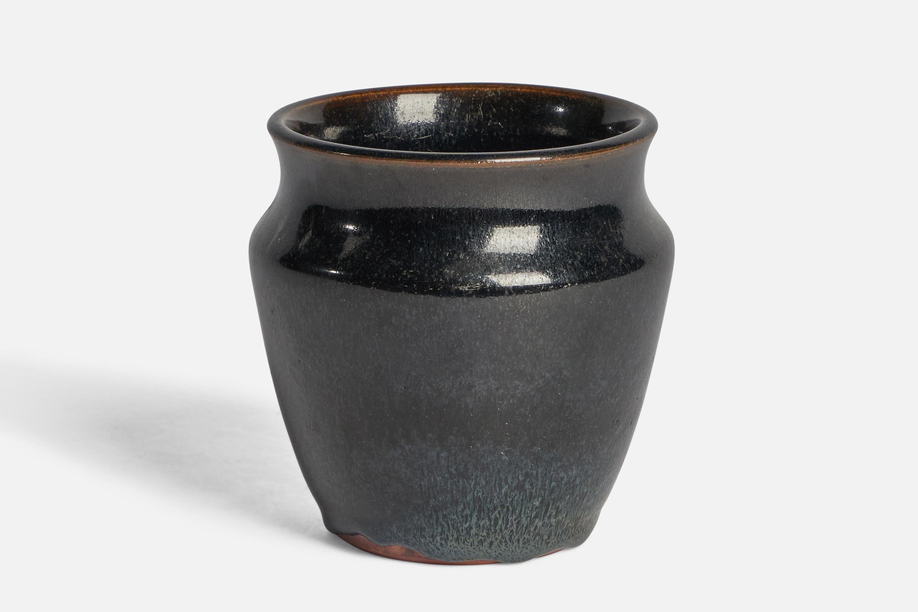 A black-glazed stoneware vase designed and produced by Rolf Palm, Mölle, Sweden, 1990.