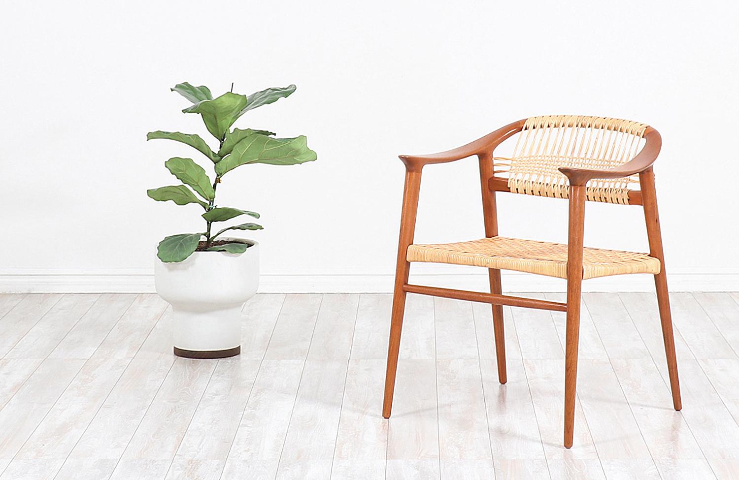 Classic modern Bambi armchair designed by Rolf Rastad and Adolf Relling for Gustav Bahus in Norway circa1950s. This iconic Bambi design is exceptionally crafted in teak wood with long and slender tapered legs and clean curved lines for a Classic