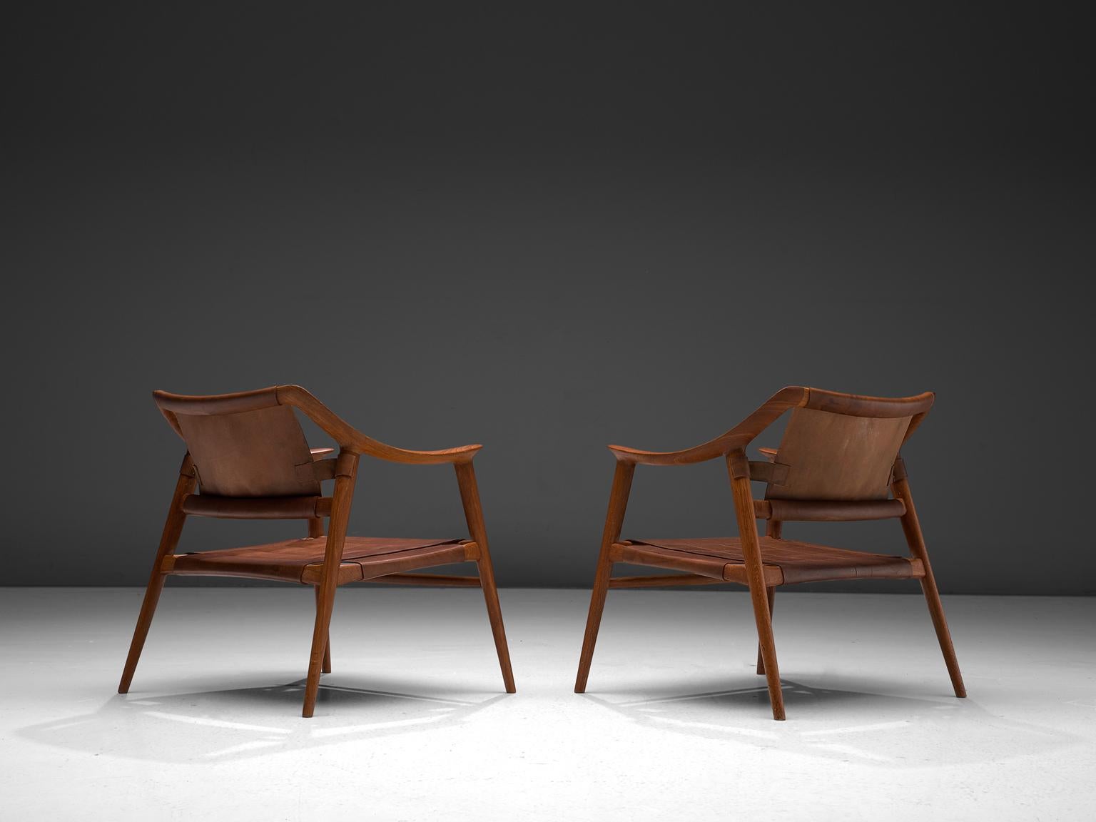 Rolf Rastad & Adolf Relling for Gustav Bahus set of two armchairs model 56/2 'Bambi', teak and leather, Norway, circa 1954. 

Excellent example of the 'Bambi' lounge chair of Rolf Rastad and Adolf Reling. This edition consist of a teak frame and