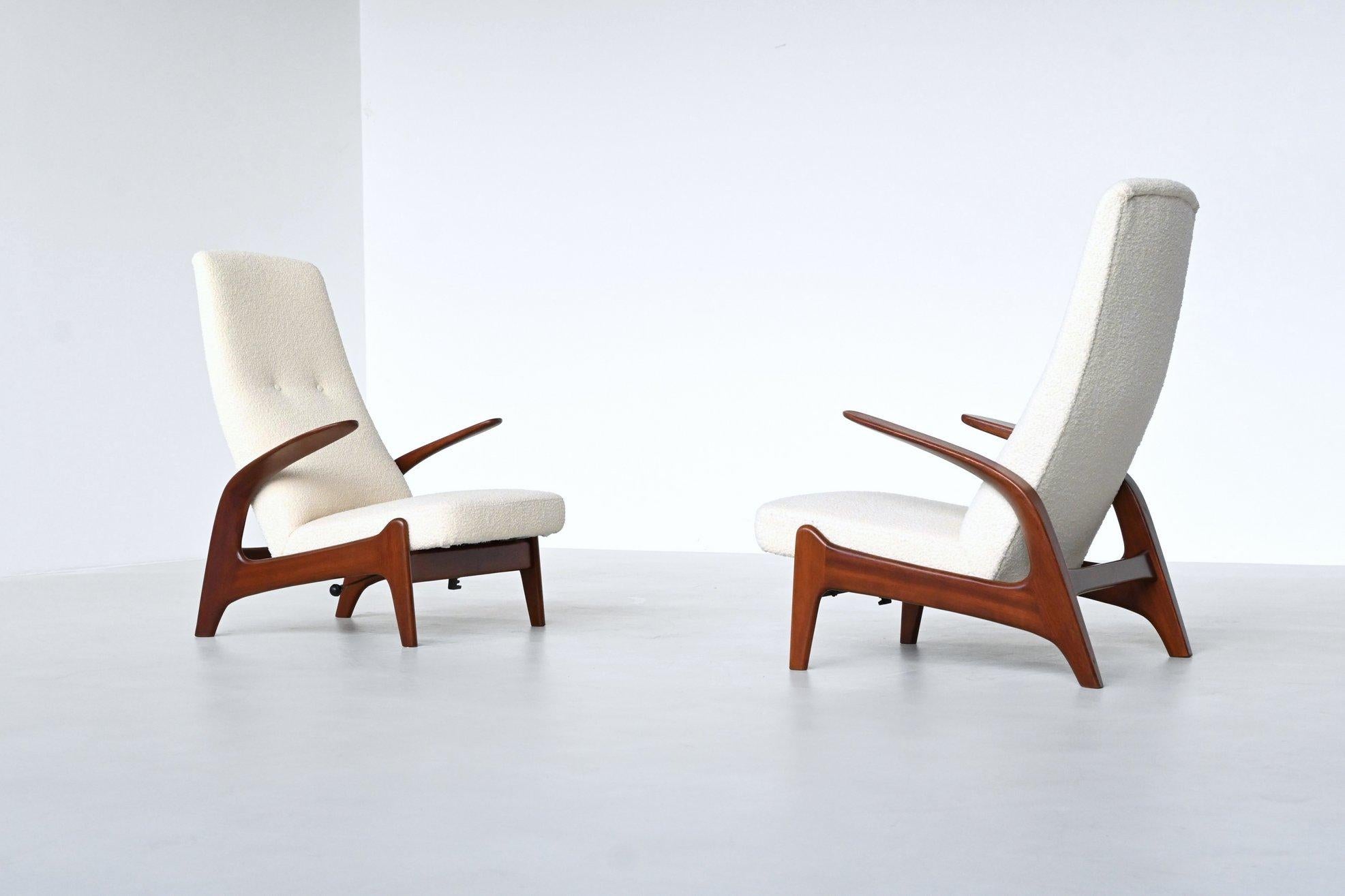 Fantastically shaped pair of reclining lounge chairs model Rock ‘n Rest designed in Norway by Rolf Rastad and Adolf Relling and manufactured in the UK by Gimson and Slater, 1960. These sculptural high back chairs feature a solid teak wooden frame