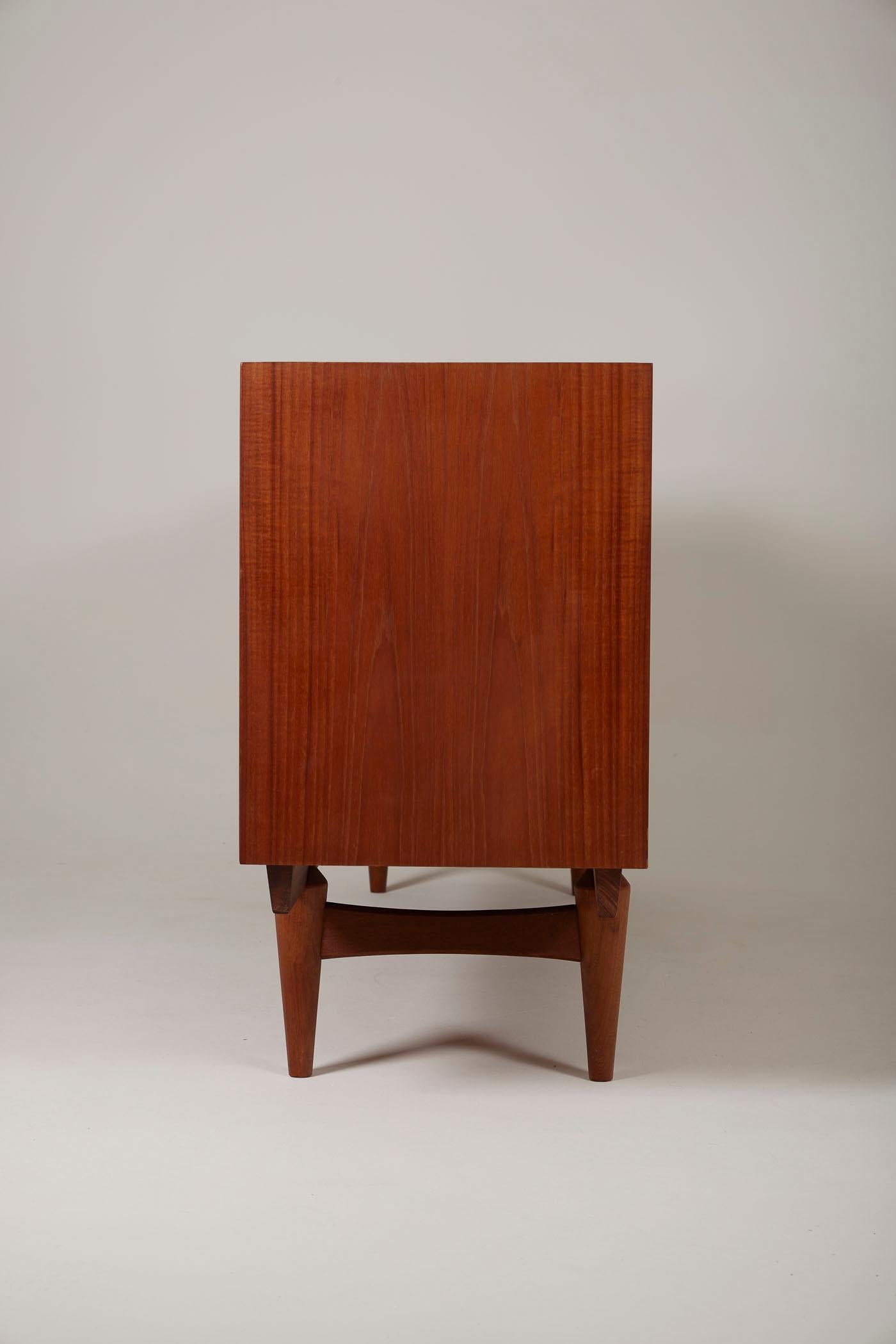 Sideboard by Norwegian designers Rolf Rastad & Adolf Relling for Gustav Bahus Norway, 1960. Teak sideboard crafted with graphic patterns. It consists of 4 doors and several storage compartments. This piece of furniture is marked with the