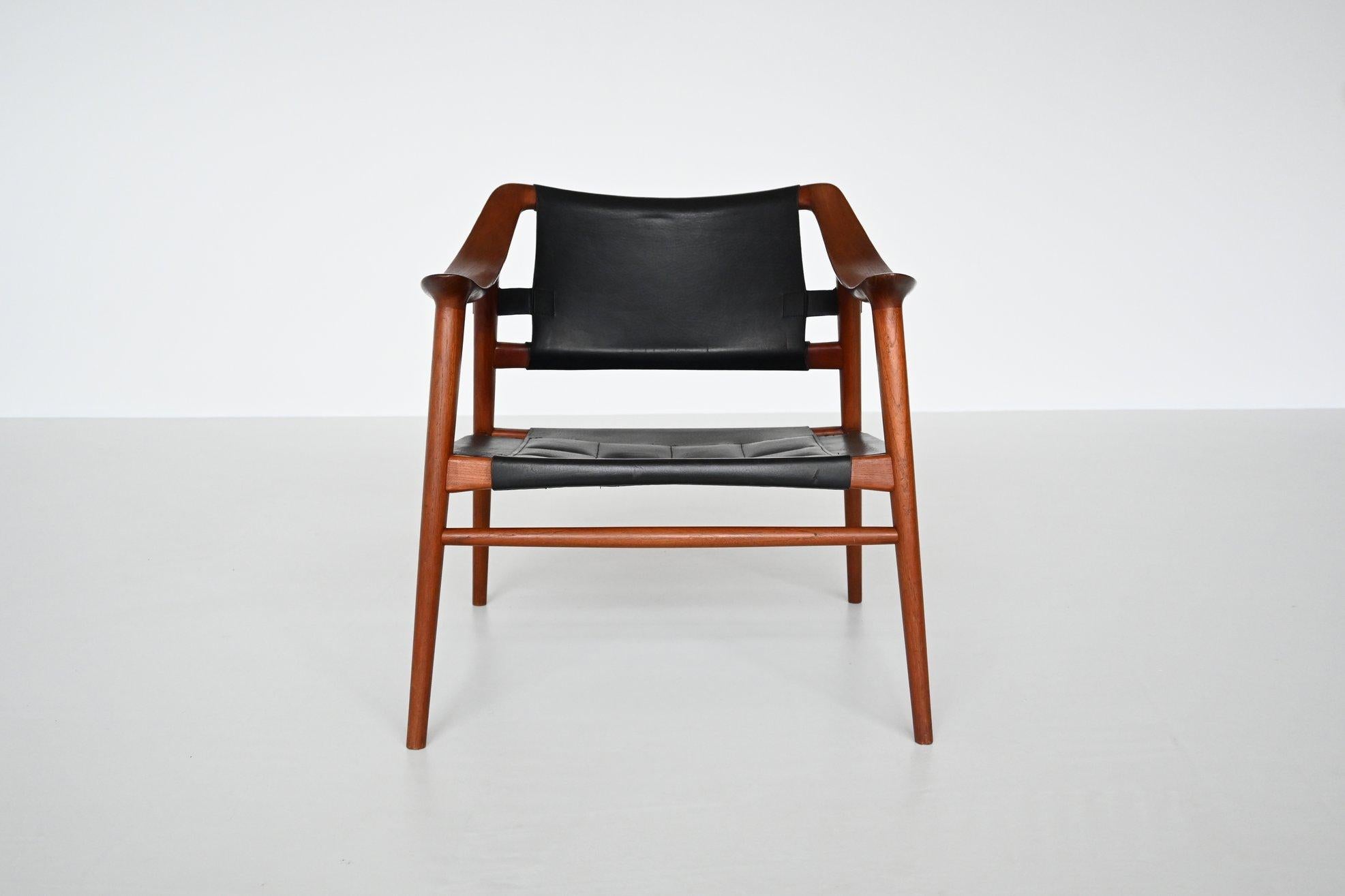 Stunning lounge chair model 56/2 designed by Rolf Rastad and Adolf Relling for Gustav Bahus, Norway, 1954. This beautiful shaped sculptural lounge chair was called ‘Bambi’. It has a solid teak wood frame with a black saddle leather stitched seat and
