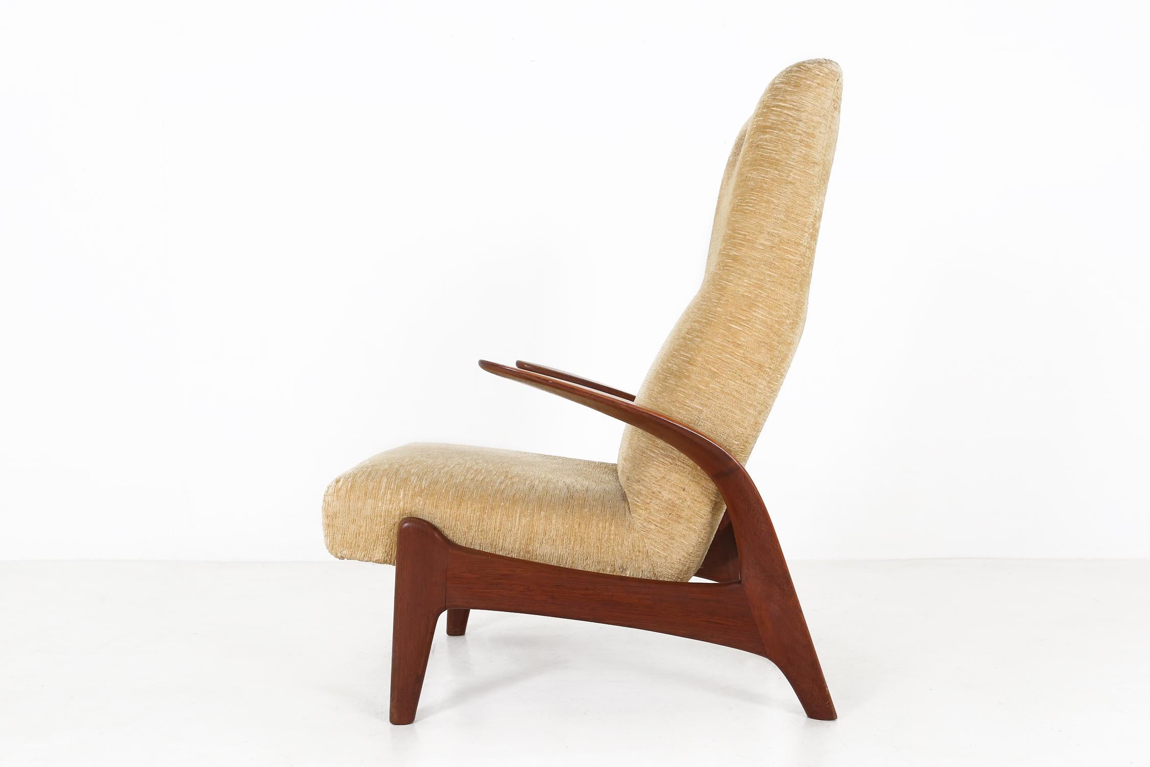 Lounge chair designed by Rolf Rastad and Adolf Relling and made in the UK by Gimson and Slater Ca.1960.Is made of a solid teak frame and yellow fabric.The chair is fitted with an adjustable mechanism to adjust the chair at seven different levels, as