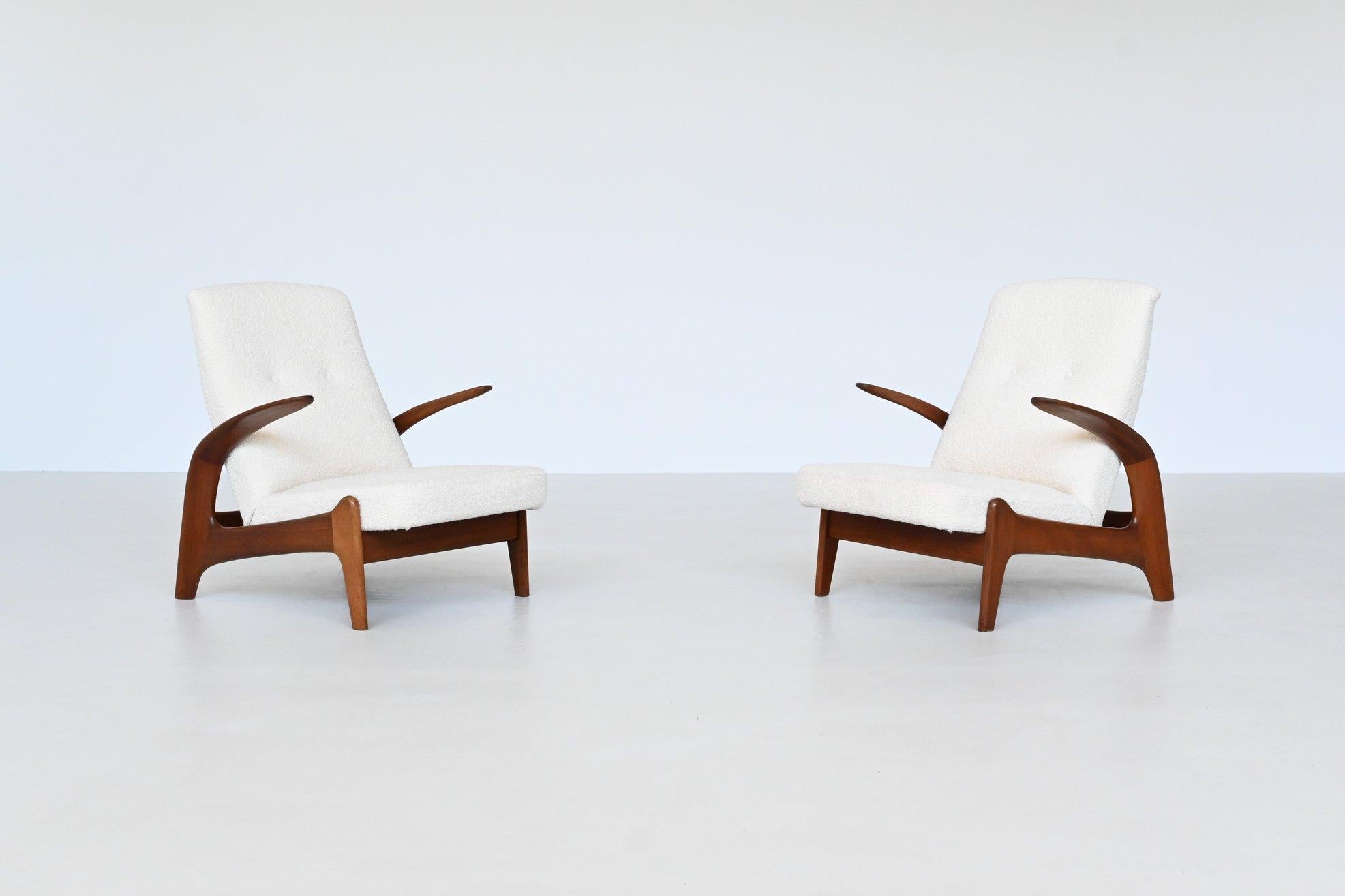 Fantastically shaped pair of lounge chairs model Rock ‘n Rest designed in Norway by Rolf Rastad and Adolf Relling and manufactured in the UK by Gimson and Slater, 1960. These sculptural low back chairs feature a solid teak wooden frame and they are