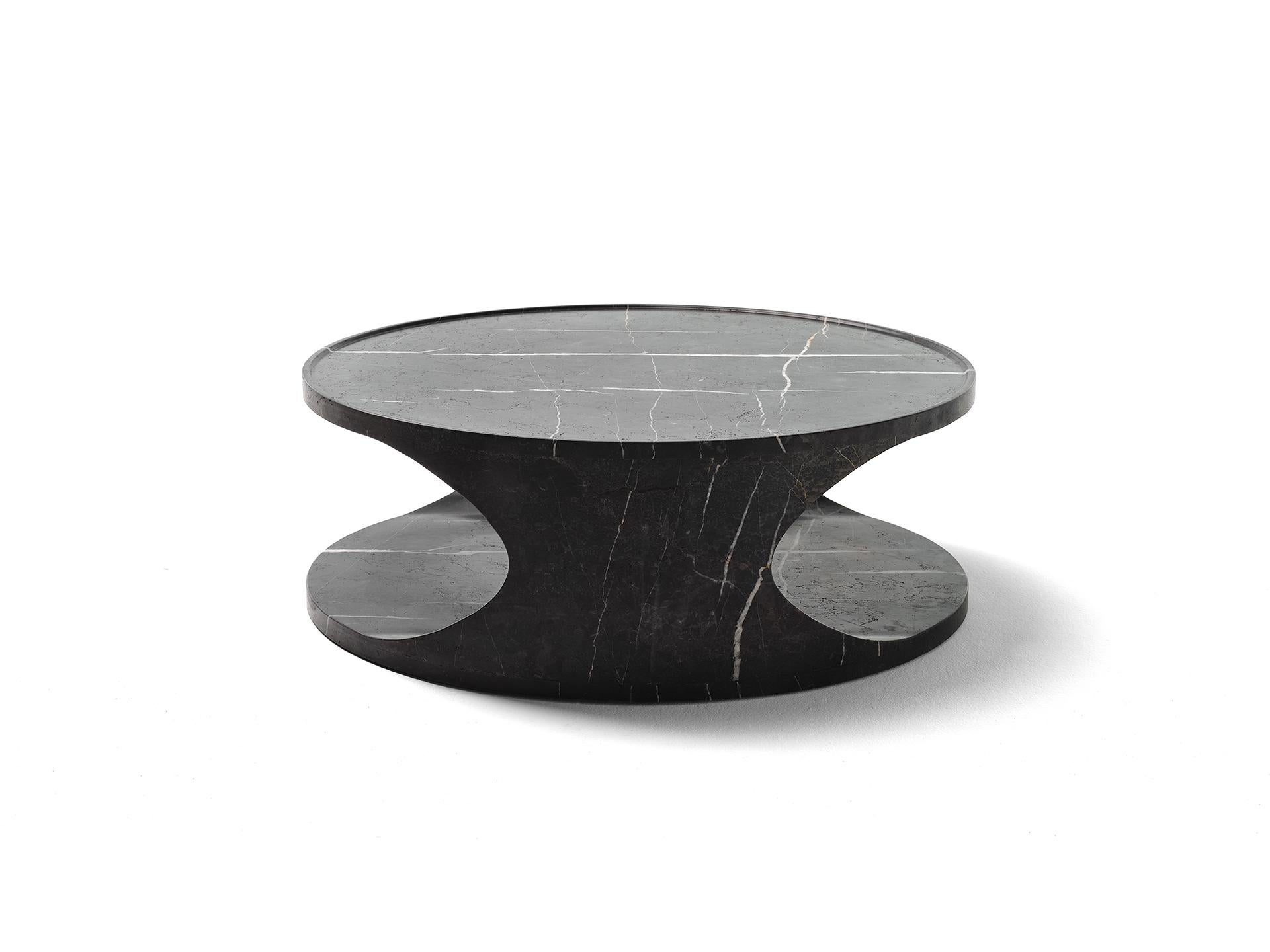 Roll low table is a sculptural solid marble piece. Its geometric and yet organic form changes dramatically when viewed from different angles. Roll is also extremely functional: its cylindrical essential volume will fit a multitude of environments