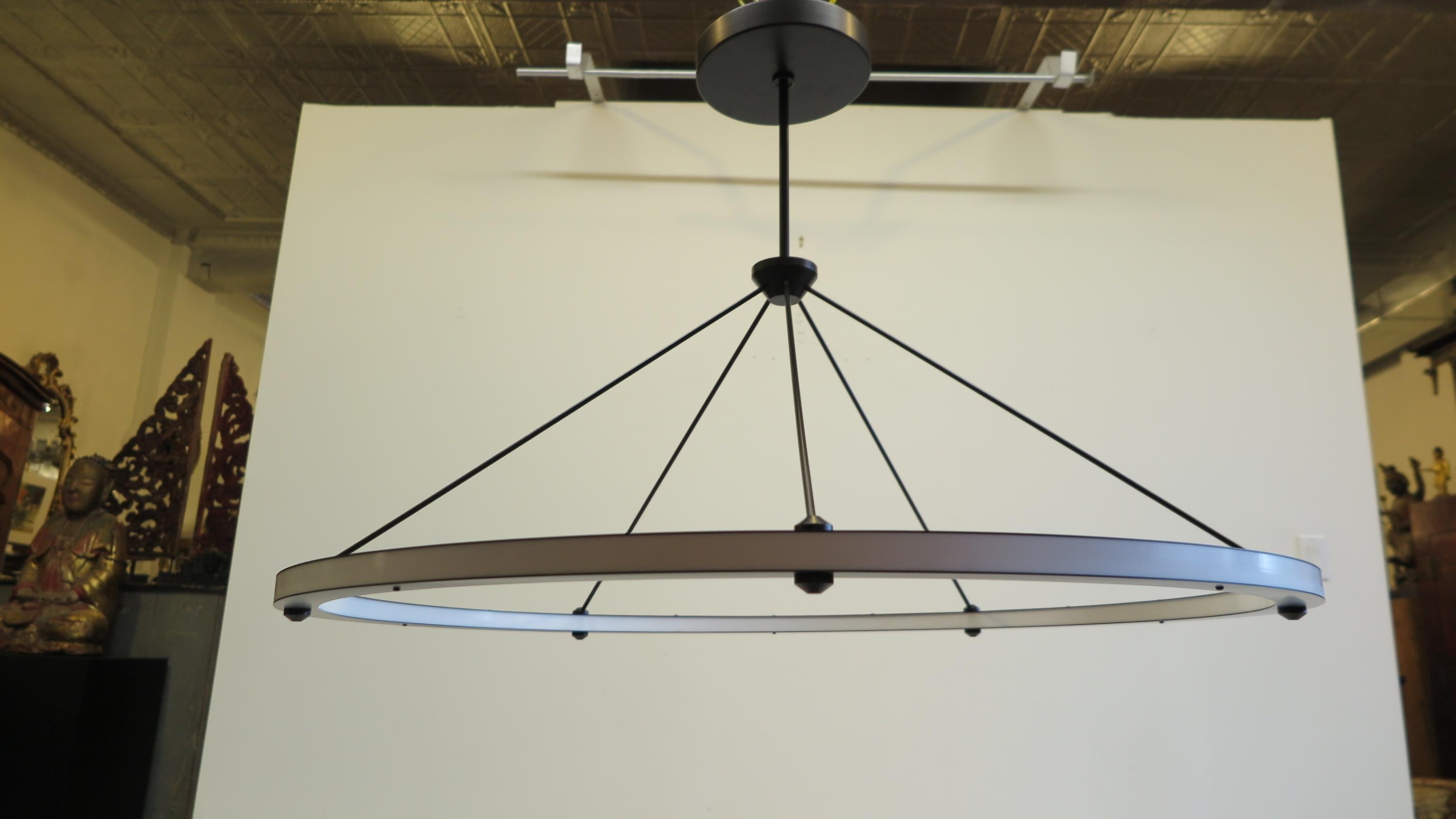 Roll & Hill Halo circle pendant light in black. An outer and inner ring of continuous illuminating Energy-efficient LED technology, completely dimmable. Fixture is in perfect working order and excellent condition. The Halo Circle Pendant Light