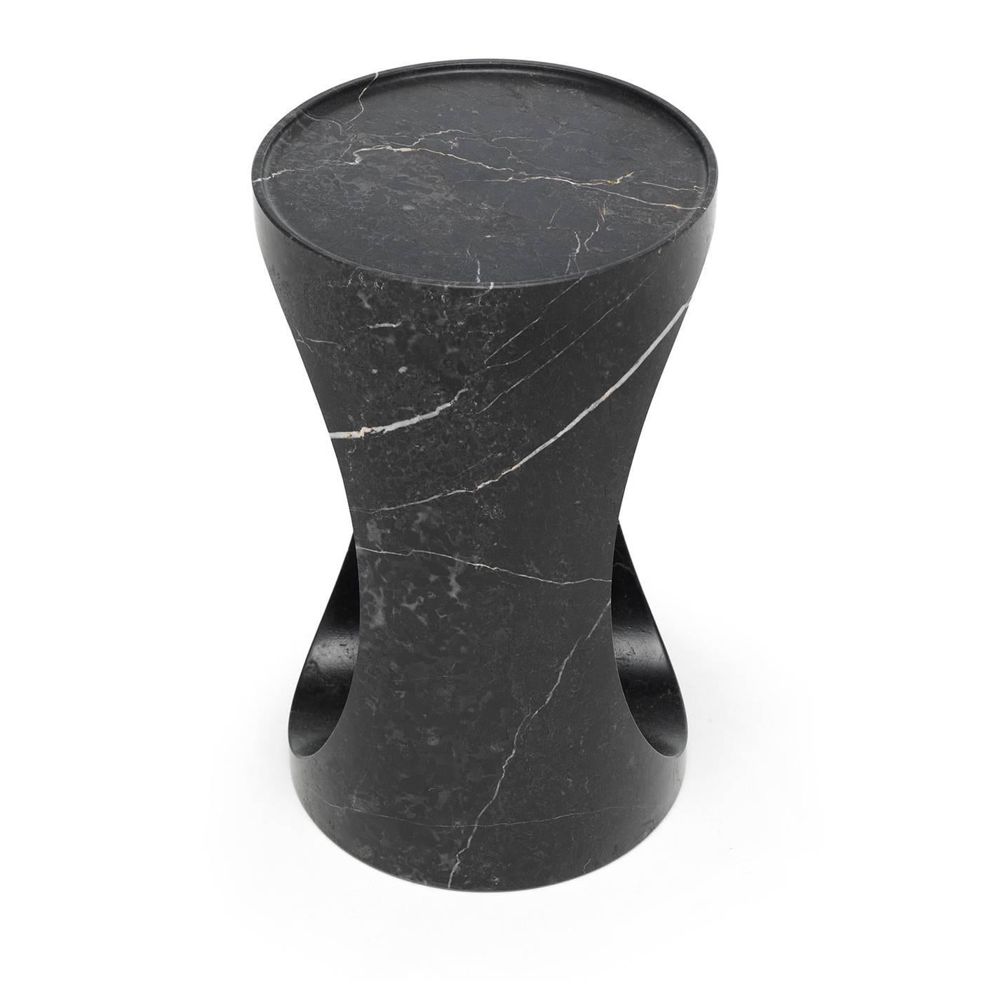 Part of the Roll collection by Federico Carandini (2016), this side table is crafted from the excess material generated from the manufacturing of the Roll dining table, in the same series. This piece features a carved lip on top and a striking