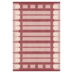 Tapis Rollakan Iris en laine framboise