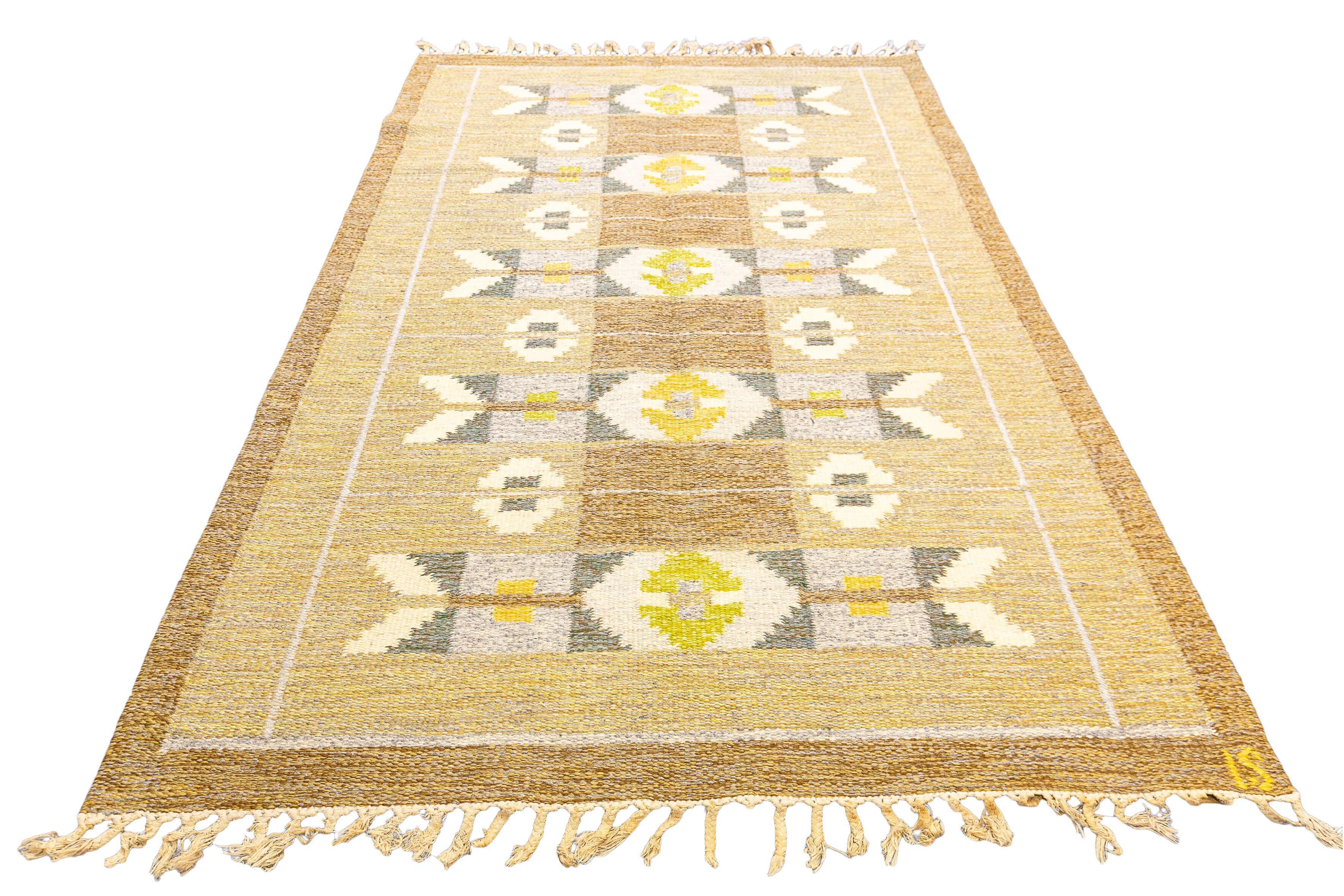 Immerse yourself in the allure of Swedish Rug Rollakan Earthy Tones with this exquisite mid-20th century rug, a true treasure that encapsulates the artistry and craftsmanship of a bygone era. Measuring 200 x 133 CM, this captivating piece carries