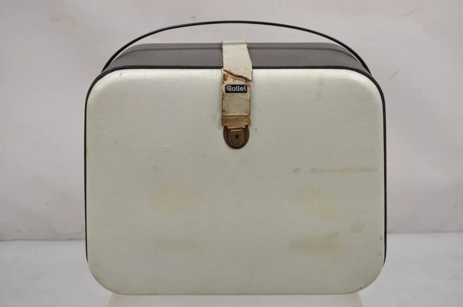 Vintage Rollei P11 Proyector de diapositivas Alemania Franke Heidecke Heidosmat para piezas/reparación con estuche y diapositivas de monumentos nacionales, incluidos Yellowstone y el Gran Cañón. Finales del siglo XX. Medidas: Estuche, 15