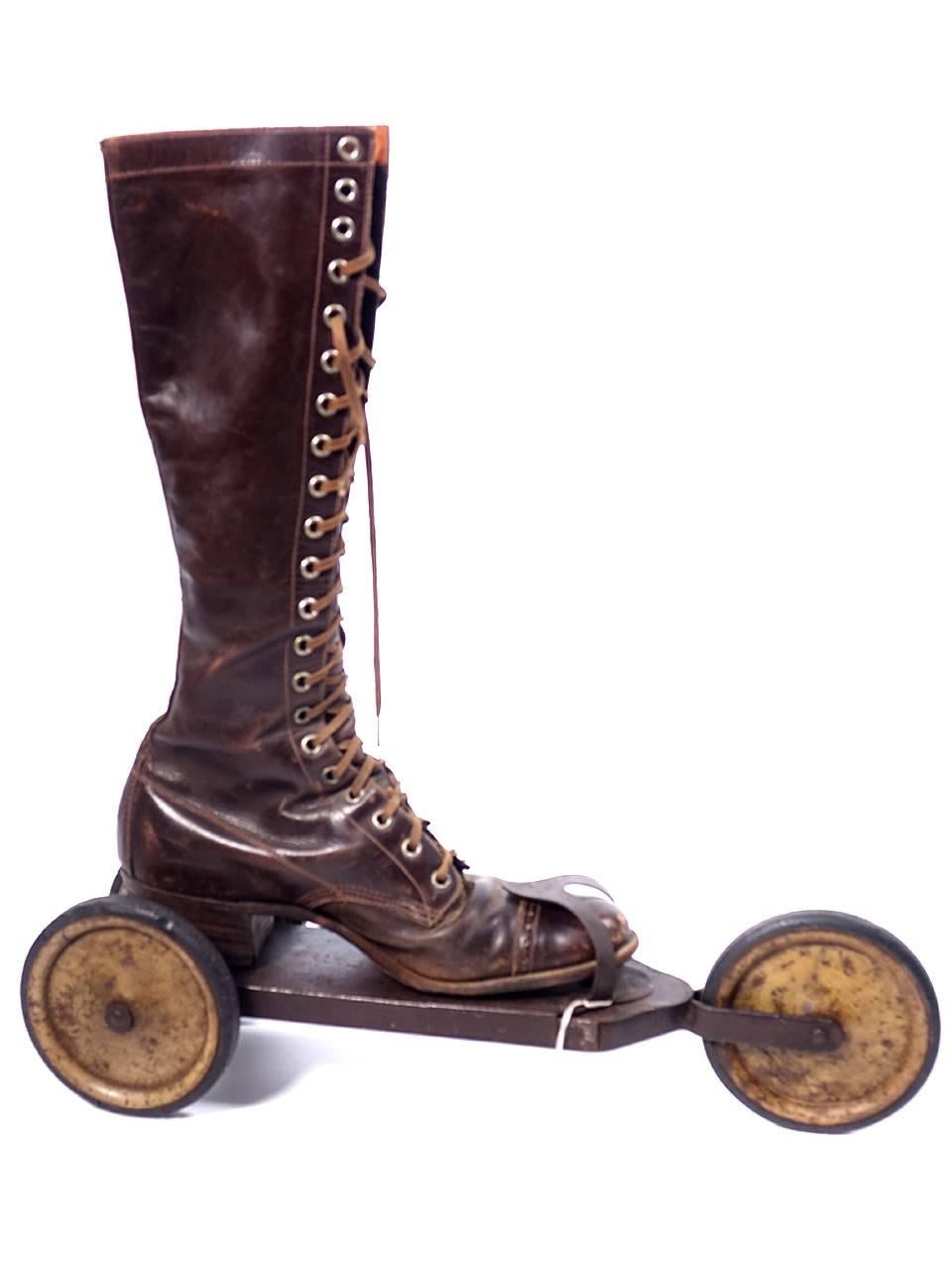 This is a rather unusual and rare pair of three-wheeled roller skates from the early 20th century. They are made of metal, with hard-rubber treads on the wheels; each skate is 16 inches long. There is no makers mark. Some research brought up skates