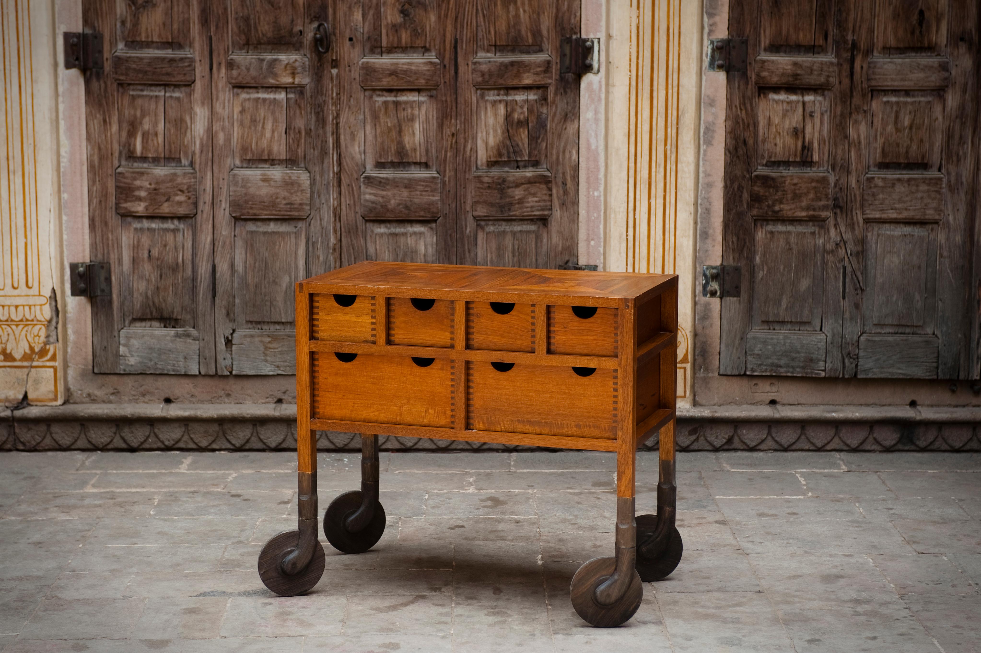 Built entirely of solid wood, the Shaker-influenced Rolling Dresser features open-frame construction and hand-carved, swiveling solid wood casters. No nails, screws, staples, pins or any metal part of fastener is used. Even the axle that the wooden