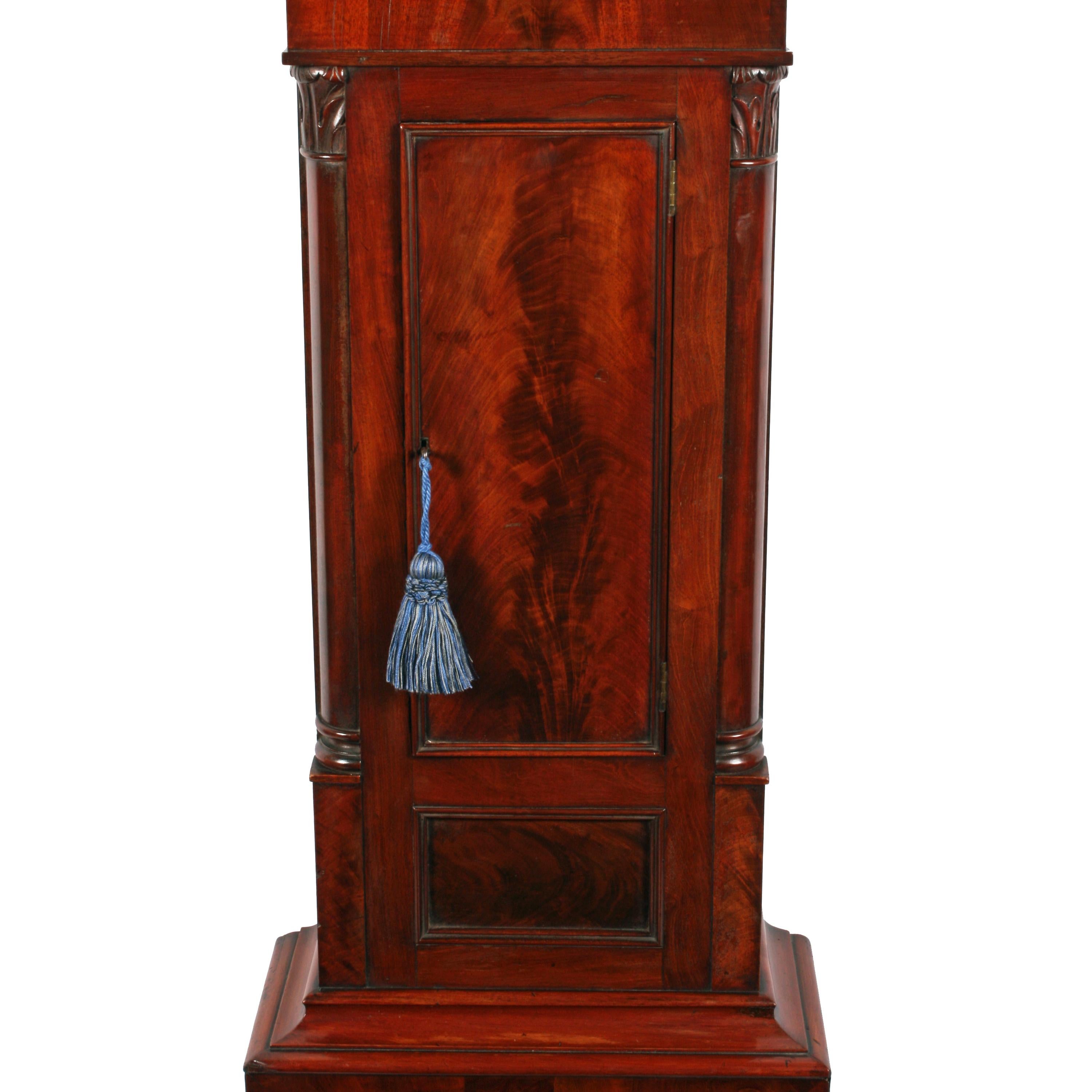 grandfather clock with moon and sun