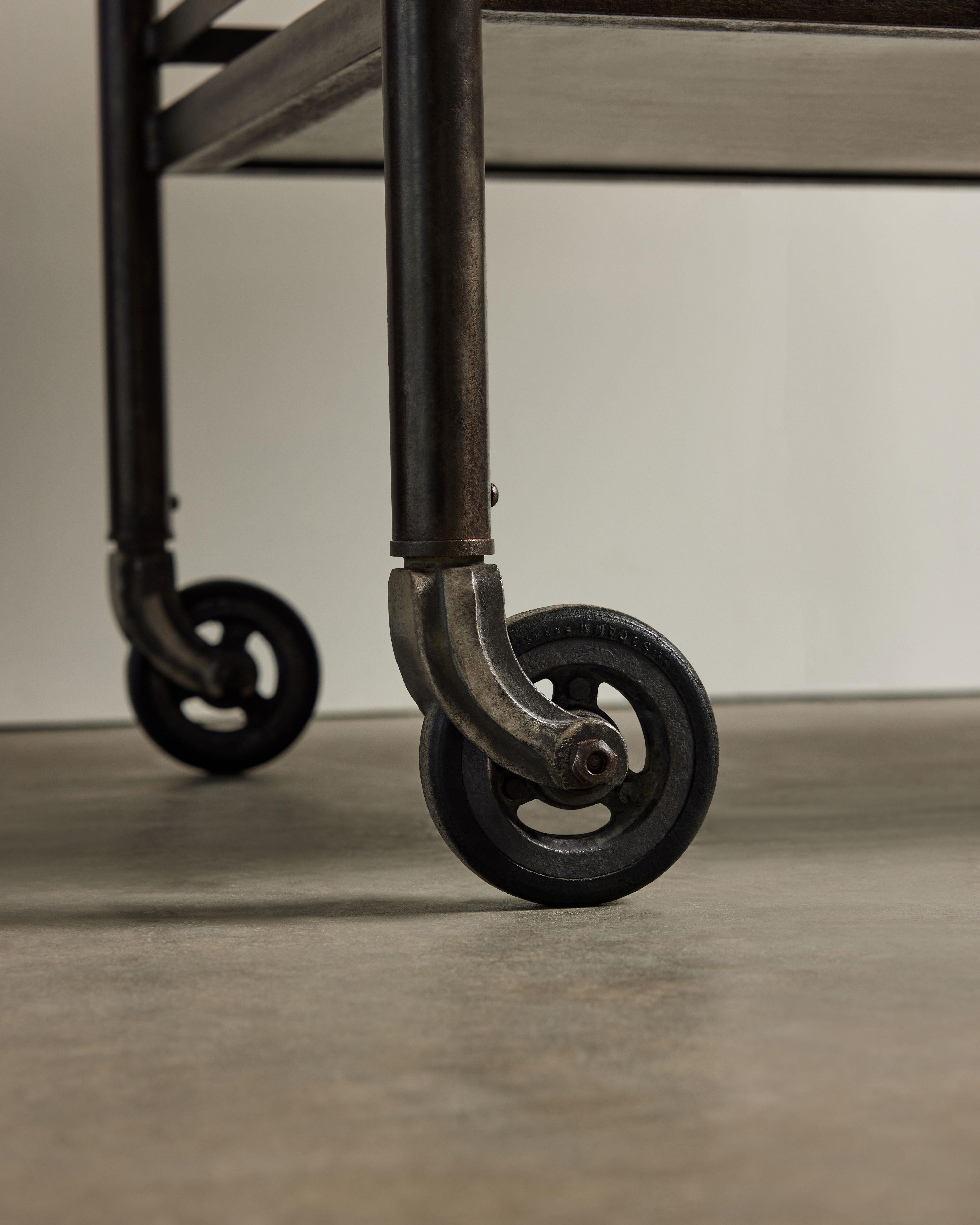 Graphic, well made industrial cart with beautifully aged steel. Recently restored and sealed.
