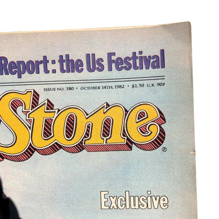 Rolling stone featuring Yoko Ono and John Lennon. John Lennon poses behind Yoko Ono on the cover of this vintage magazine. This piece is in good condition for its age.