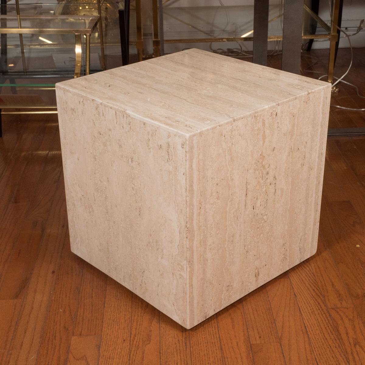 Rolling travertine cube table.

