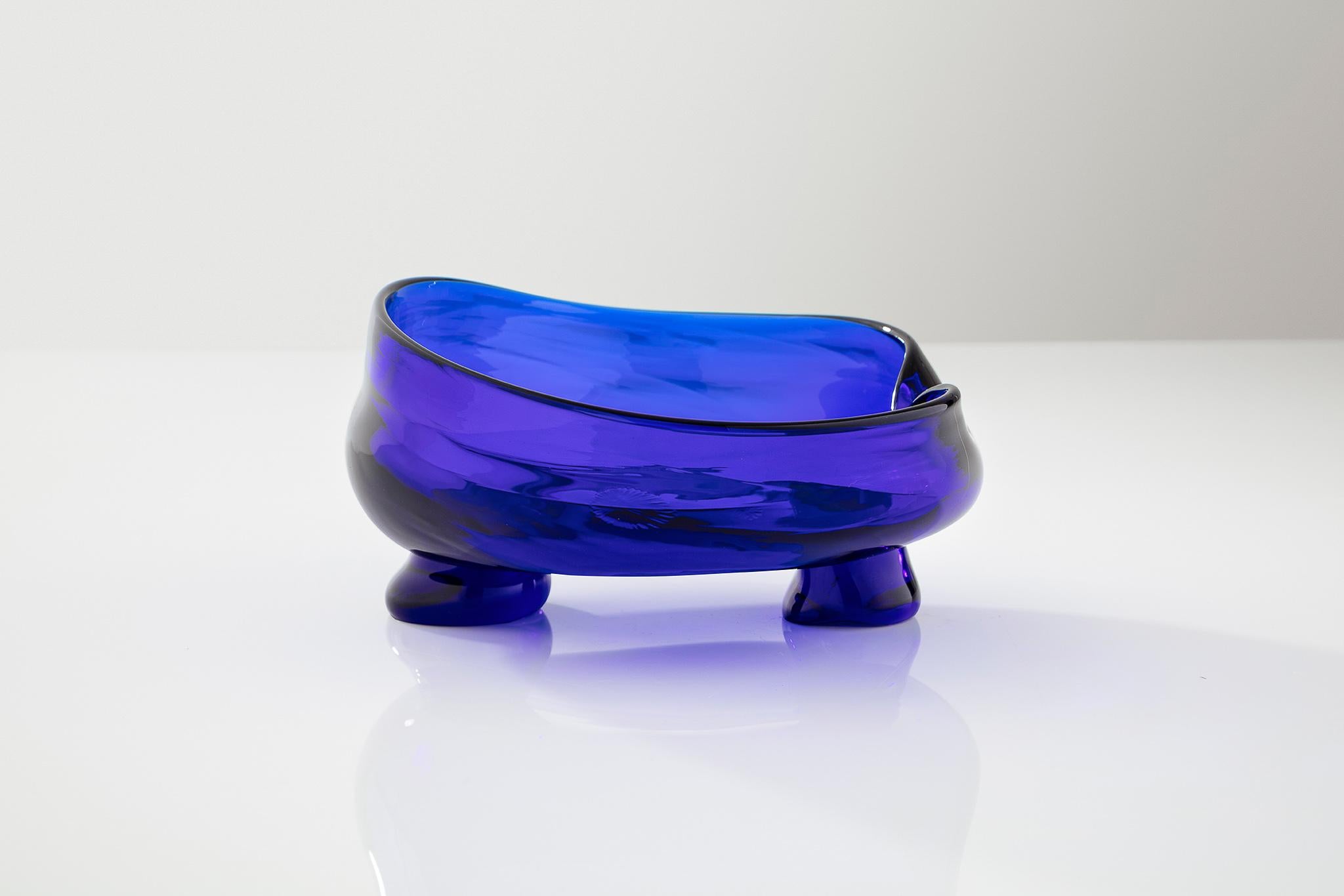 Fluid in form, this glass sculpture appears malleable with soothing slopes and rounded edges. Inspired by rolling waves, in Yves Klein Blue, this vibrant centerpiece is featured in the Fort Makers Blue Room collection.

Handmade by Jason Bauer and