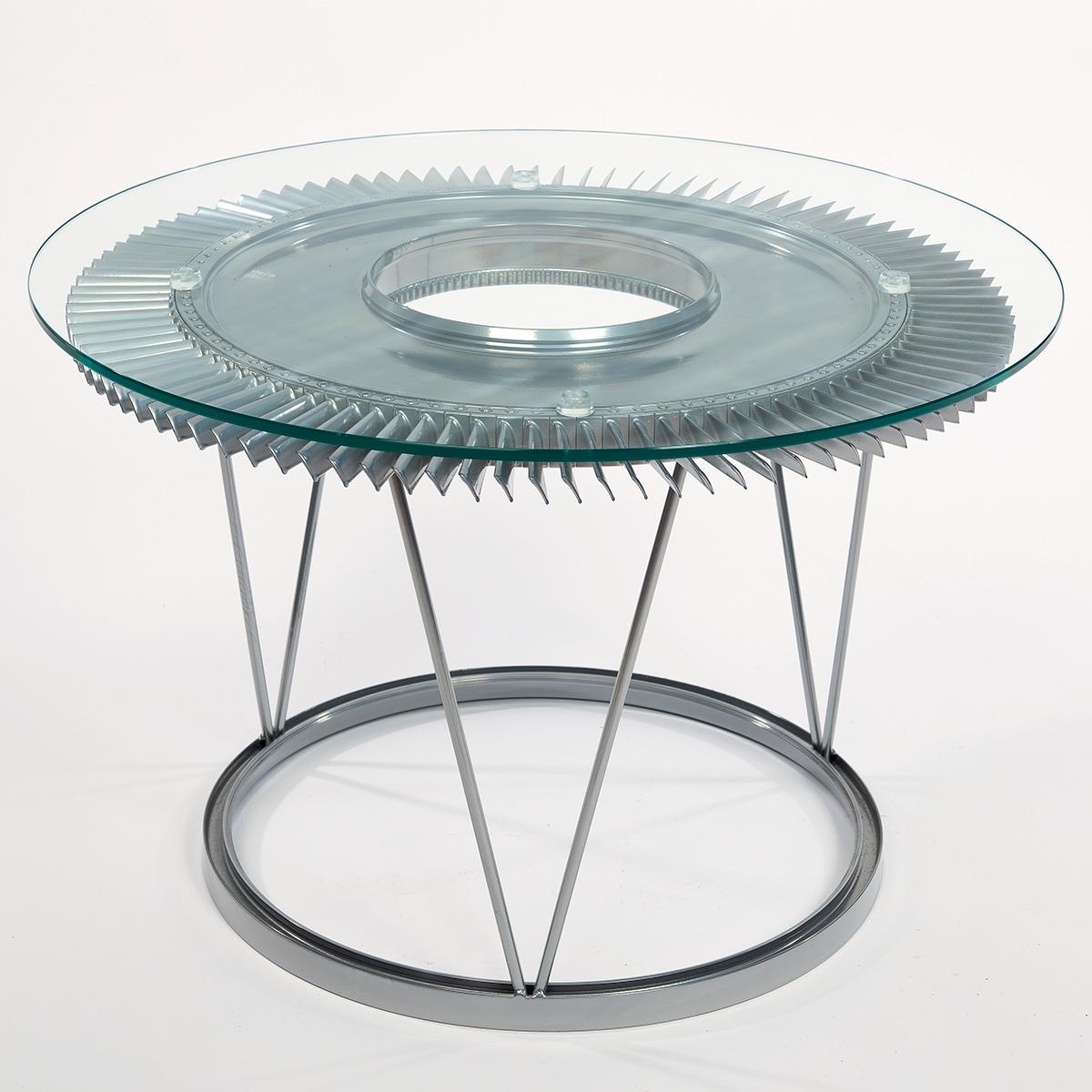 The base of our stunning coffee table is a professionally stripped and chrome polished fan blade from a Rolls Royce Avon jet engine from a RAF Canberra bomber. The table top is toughened/ secure glass.

The Royal Air Force English Electric Canberra