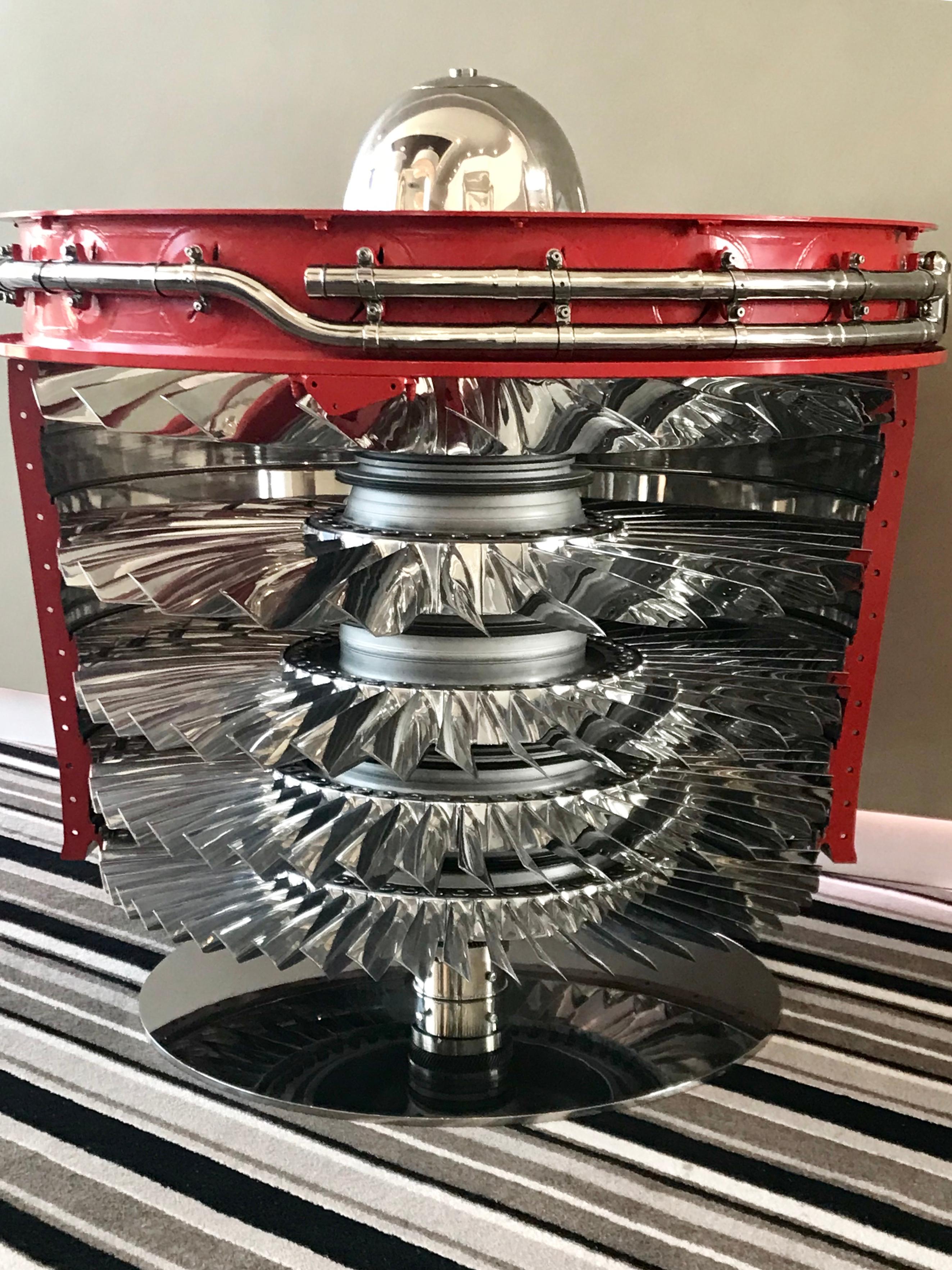 The epitome of style and elegance, Rolls Royce genuine assembly parts are at the heart of this stunning object. 179 individually highly polished blades set within its original outer casing form part of this stunning centre table.

Please note the