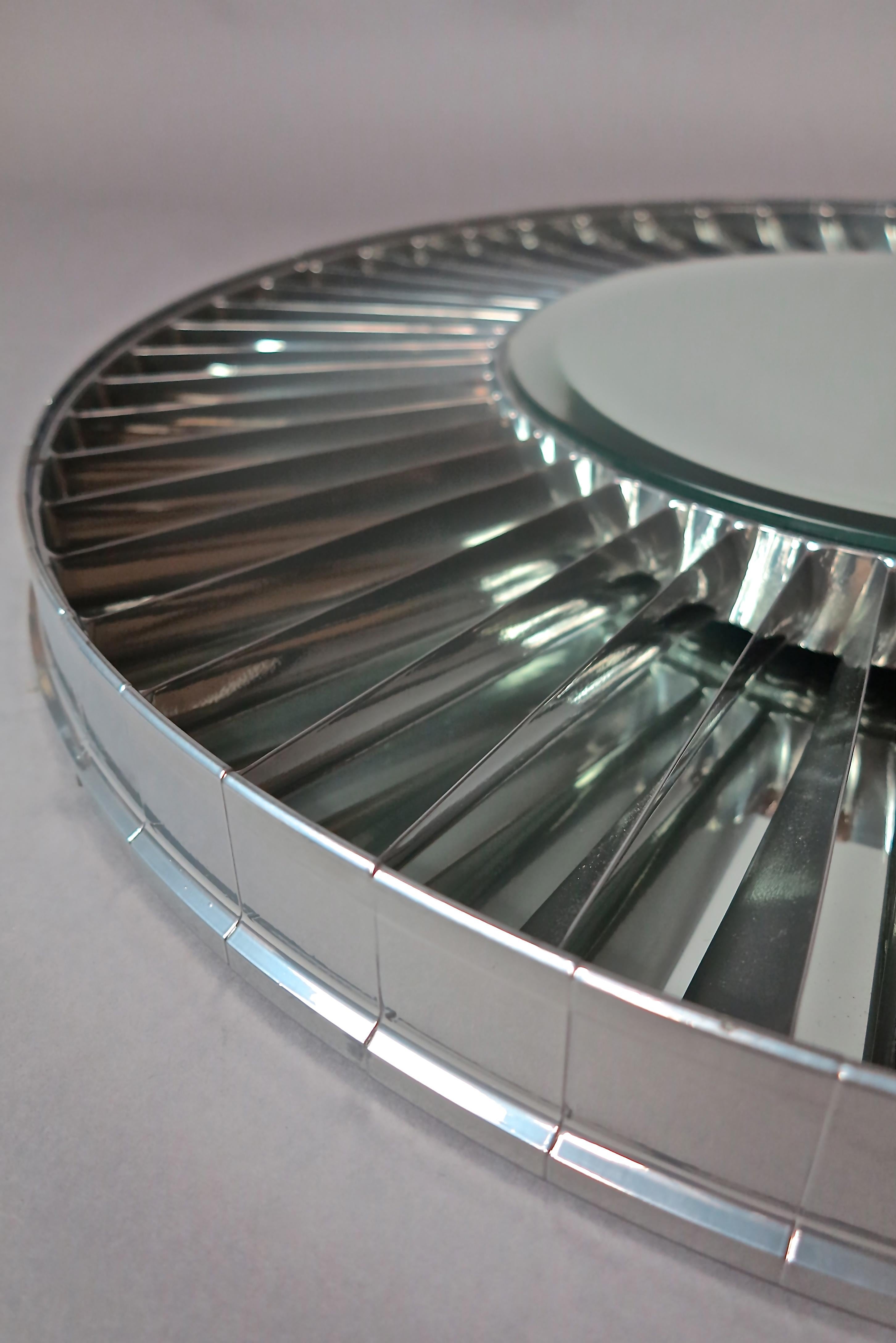 Crafted from a Rolls Royce Gas Turbine jet engine our skilled craftsmen have created a very detailed, mirror from the stator blades within a Spey Aircraft Engine

The stator blades have been powder coated and mounted with a bevel edge mirror