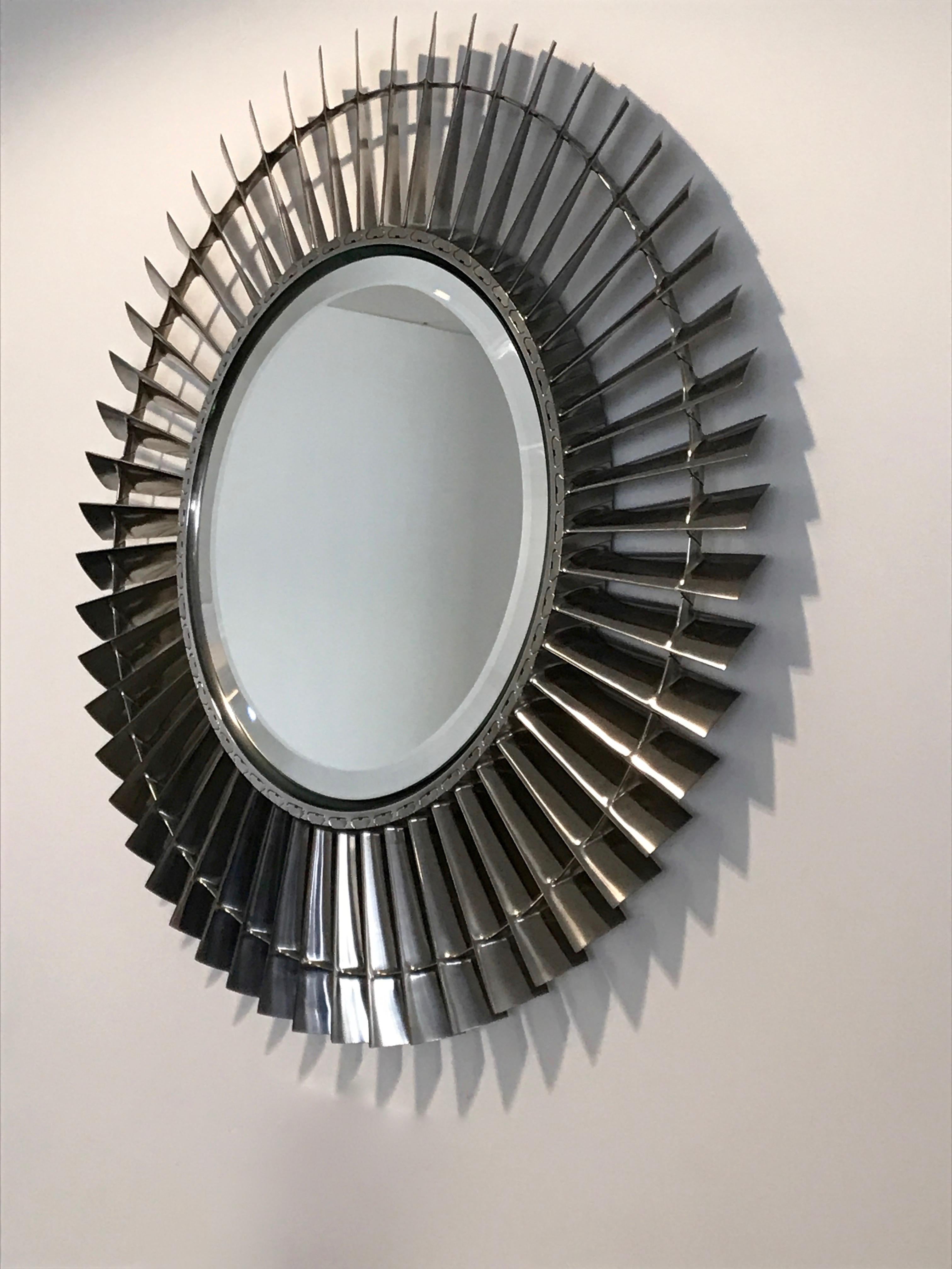 Crafted from a Military Specification Rolls Royce Spey jet engine our skilled craftsmen have created a very detailed, highly polished mirror from a LP5, (Low Pressure Compressor Fan). 53 Titanium fan blades mounted to its original hub with a bevel