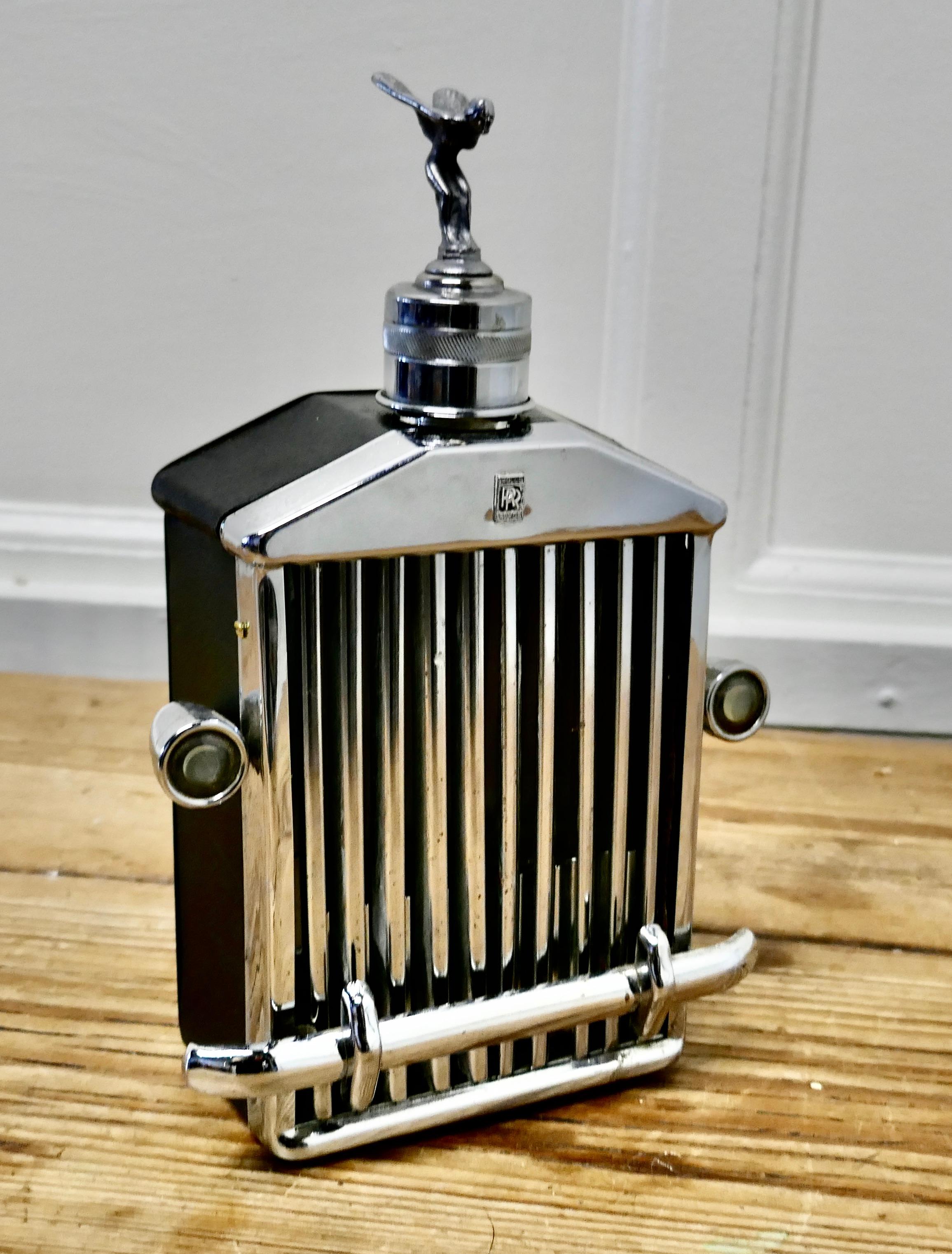 Rolls Royce Radiator Musical Decanter Sprit of Ecstasy Mascot,

1960s/1970s Rare Rolls Royce Musical Decanter

Large Desk Ornament, Rolls Royce Musical Decanter with the “Silver Sprit of Ecstasy” Mascot by Charles Sykes Silver Spirit

This is