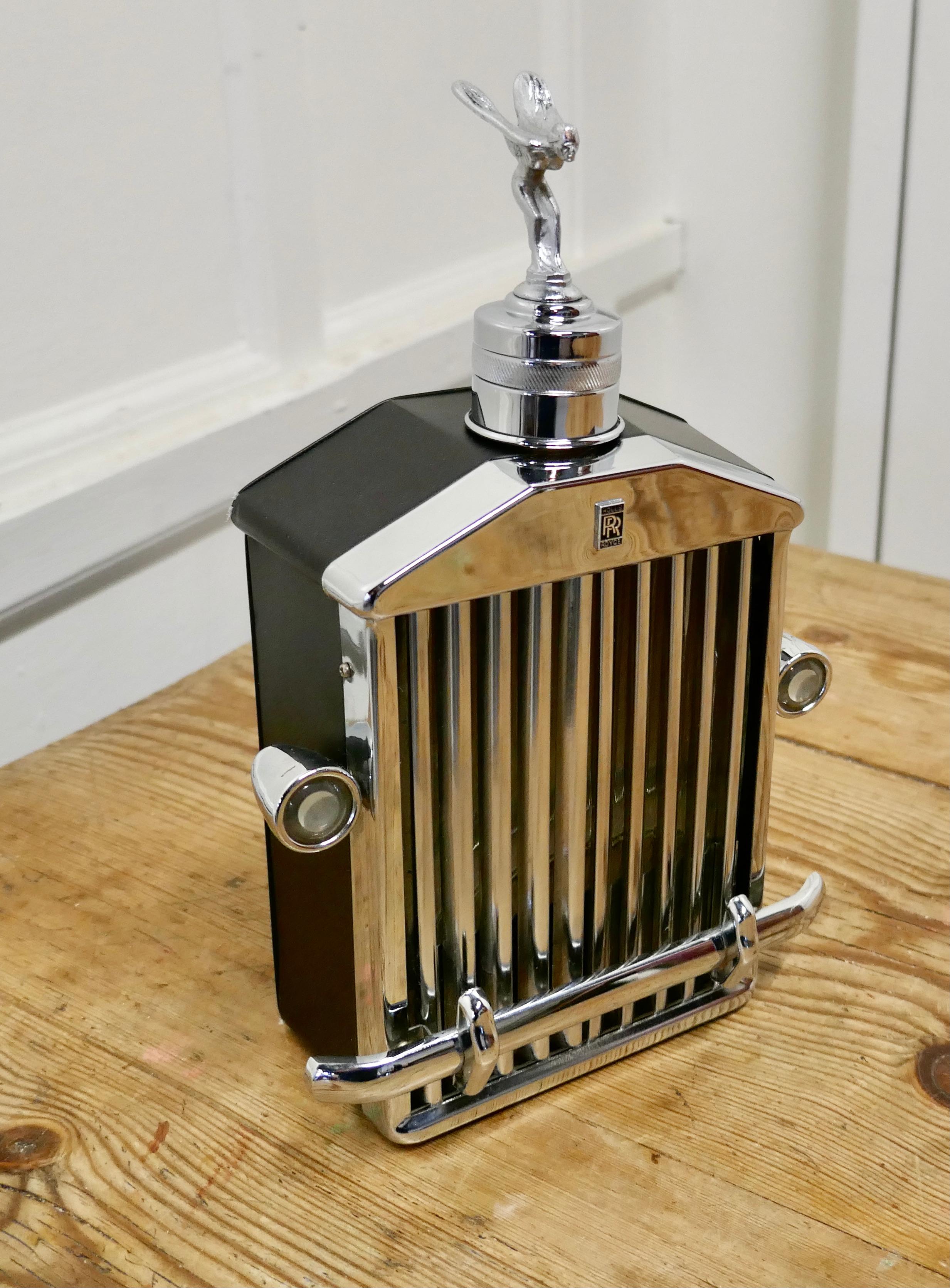 Rolls Royce radiator musical decanter sprit of Ecstasy Mascot

1960s-1970s Rare Rolls Royce musical decanter

Large desk ornament, Rolls Royce musical decanter with the “Silver Sprit of Ecstasy” Mascot by Charles Sykes Silver Spirit

This is a