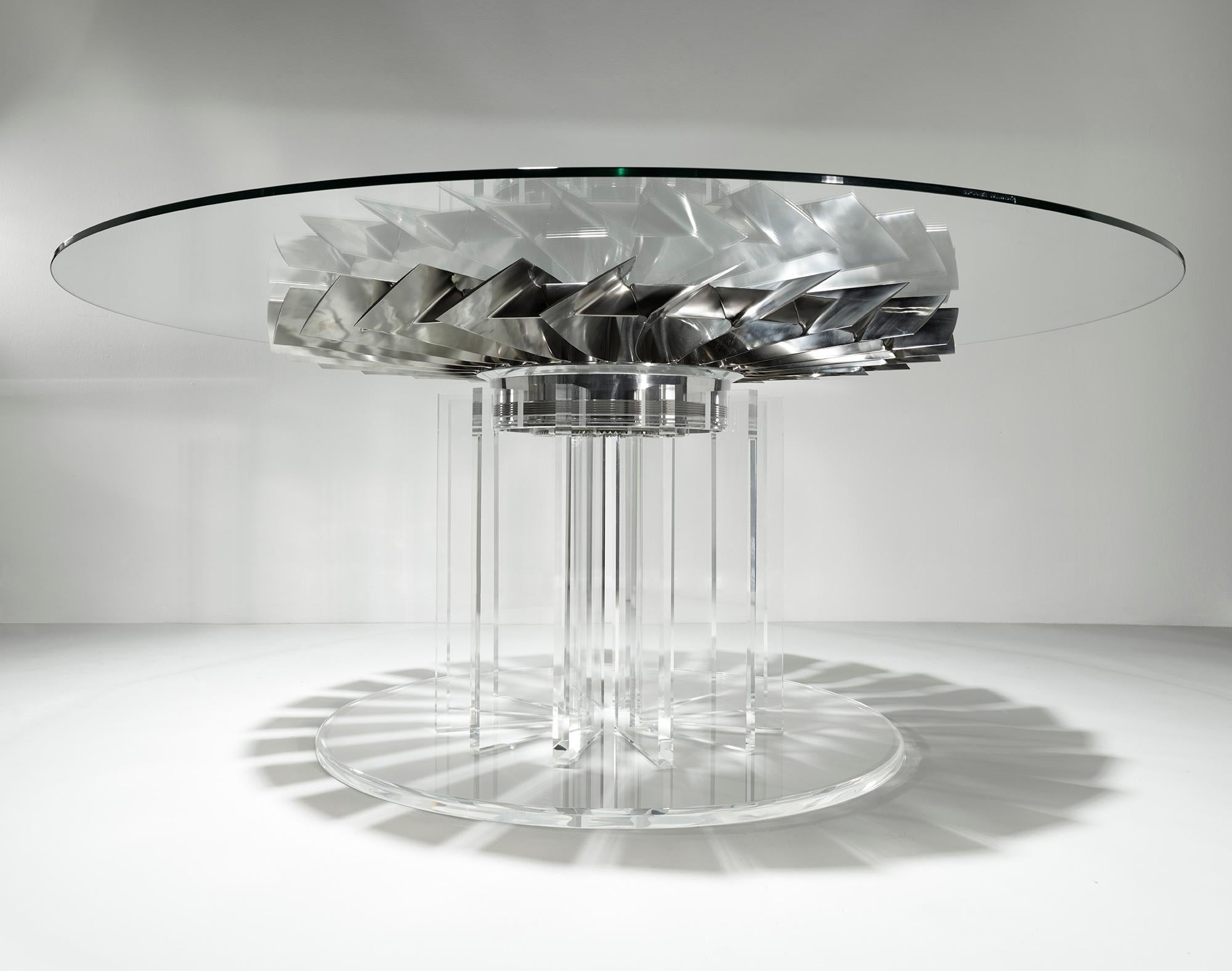 Absolutely beautiful dining table with 26 individually polished titanium blades, positioned on top of a bespoke Perspex base, underneath glass. A very unique statement piece.

The fan used in making this table is from a Rolls Royce Pegasus Sea